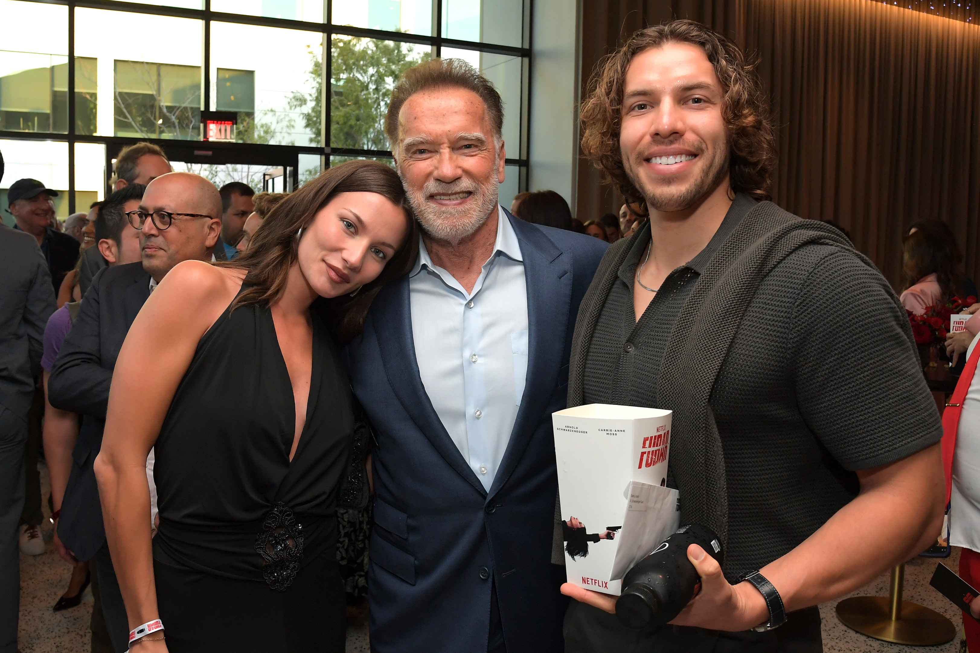 Guest, Arnold Schwarzenegger and Joseph Baena attend Netflix's Los Angeles premiere of "FUBAR" Season 2 at Netflix Tudum Theater on June 11, 2025, in Los Angeles, California. | Source: Getty Images