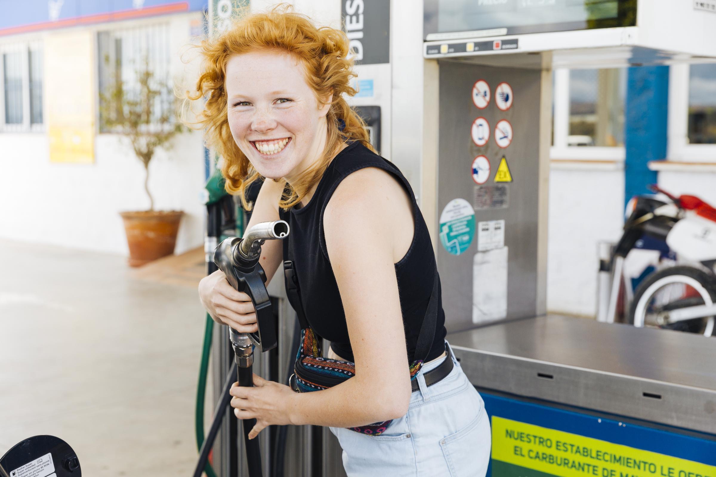 A woman working at a gas station | Source: Freepik