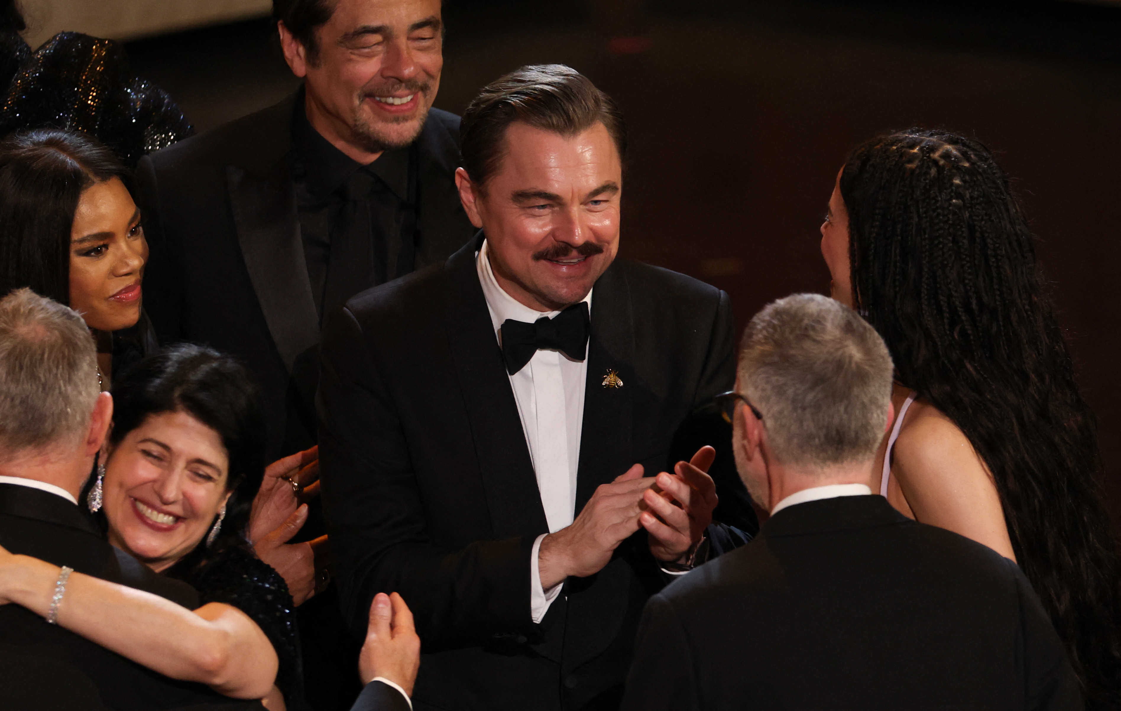 Paul Thomas Anderson celebrates with US actress Chase Infiniti, US actor Leonardo DiCaprio and Puerto Rican actor Benicio Del Toro as they accept the award for Best Picture for "One Battle After Another" onstage during the 98th Annual Academy Awards at the Dolby Theatre in Hollywood, California on March 15, 2026. | Source: Getty Images