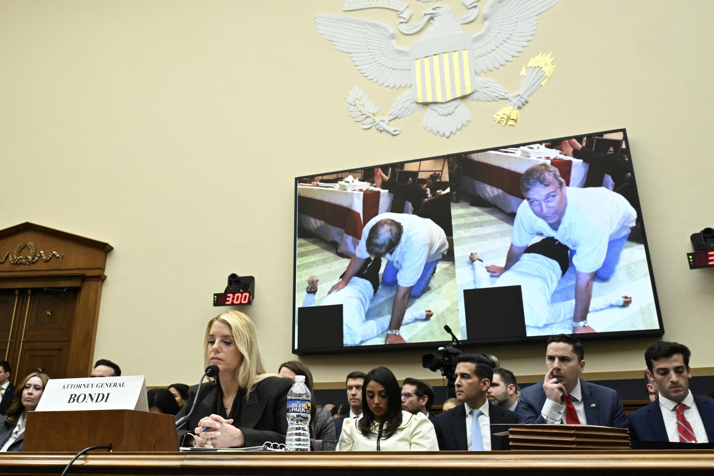 A photo of Andrew Mountbatten Windsor is displayed as US Attorney General Pam Bondi testifies during a House Judiciary Committee hearing on "Oversight of the Department of Justice" on Capitol Hill in Washington, DC, on February 11, 2026. | Source: Getty Images