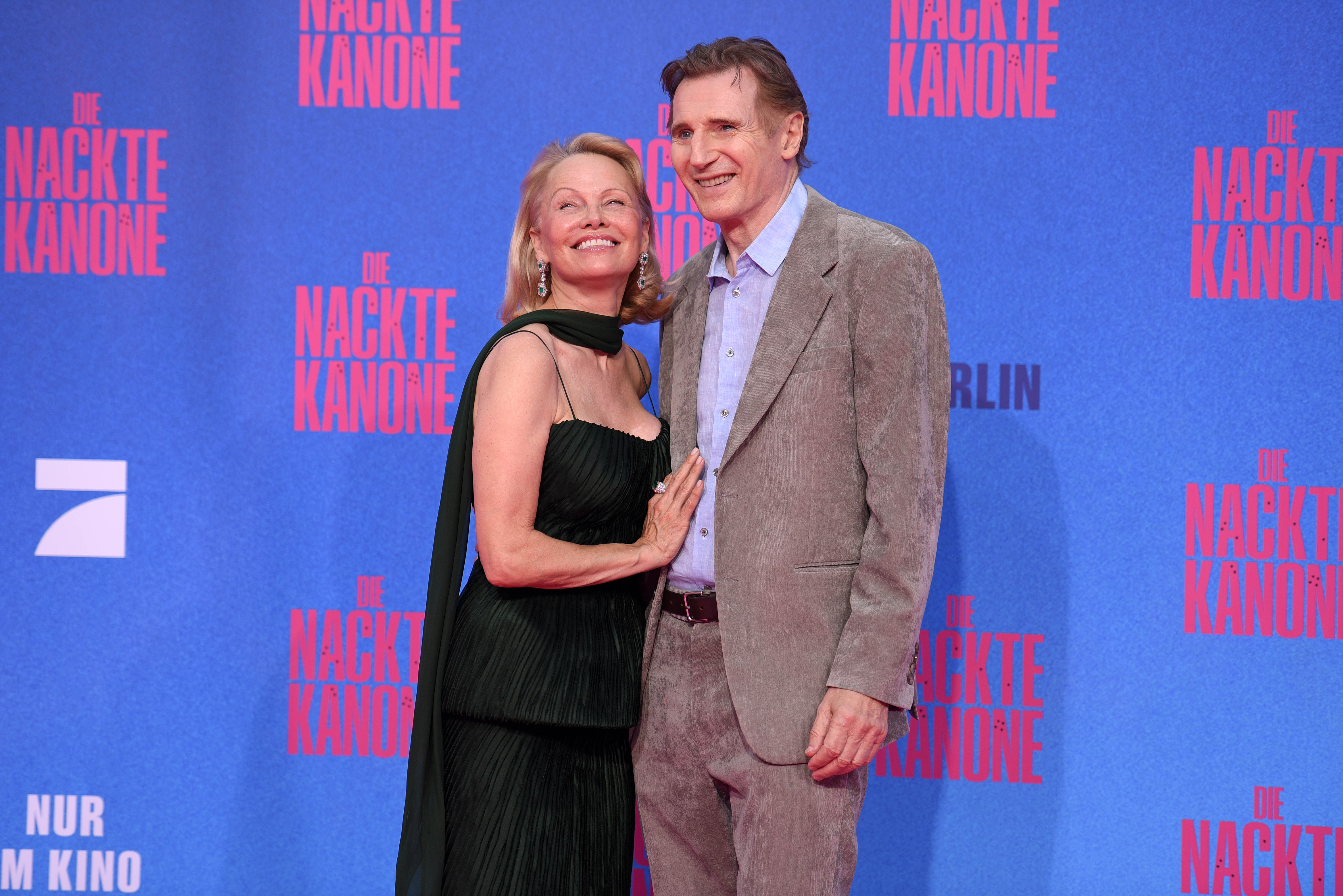 Pamela Anderson and Liam Neeson attend the Berlin premiere of the movie "The Naked Gun" on July 24, 2025 in Berlin, Germany. | Source: Getty Images