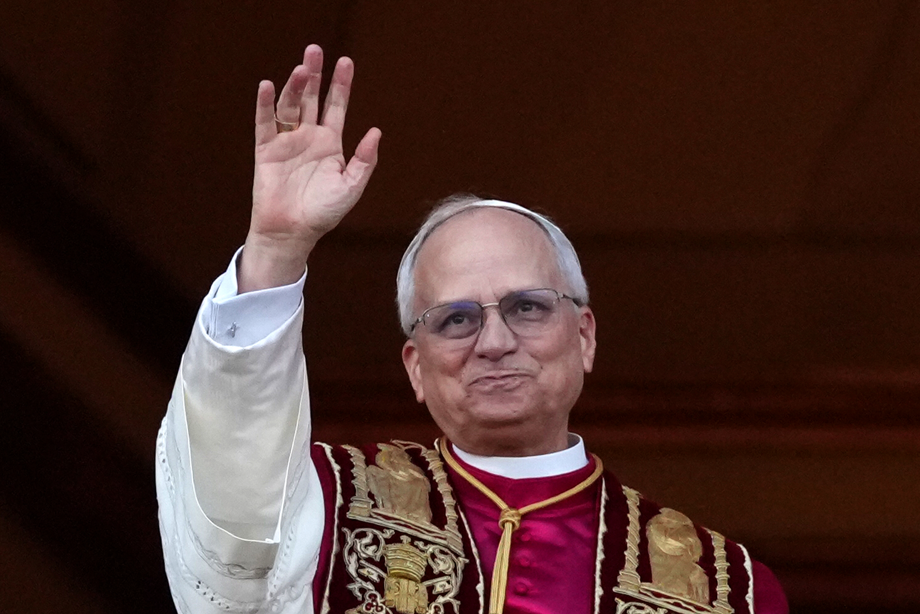 Pope Leo XIV waving at the crowd from the Vatican balcony on May 8, 2025 in Vatican City, Vatican. | Source: Getty Images