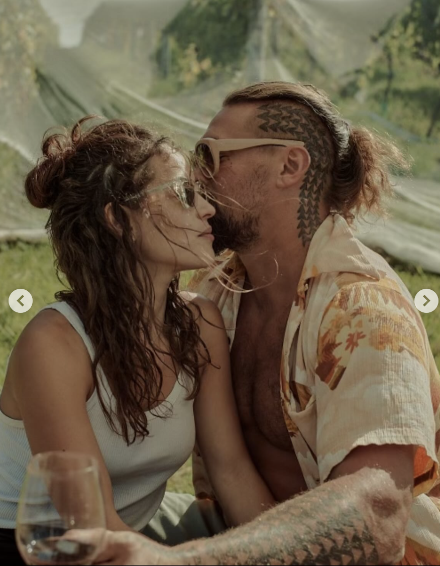 Jason Momoa and Adria Arjona share an intimate moment, posted on August 1, 2025. | Source: Instagram/adriaarjona