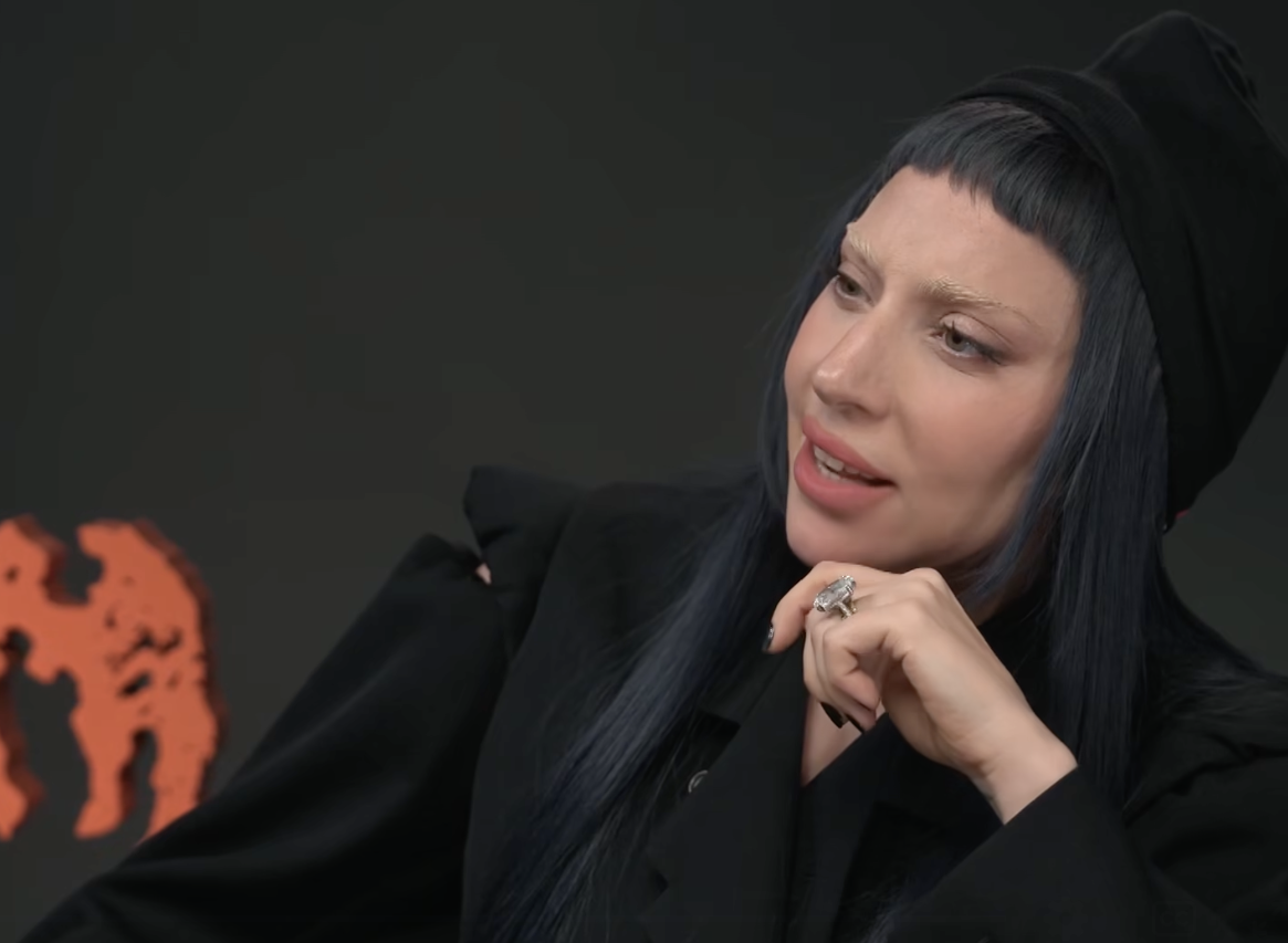 Lady Gaga shows off her massive engagement ring during an interview, posted on August 20, 2025. | Source: Facebook/Entertainment Tonight
