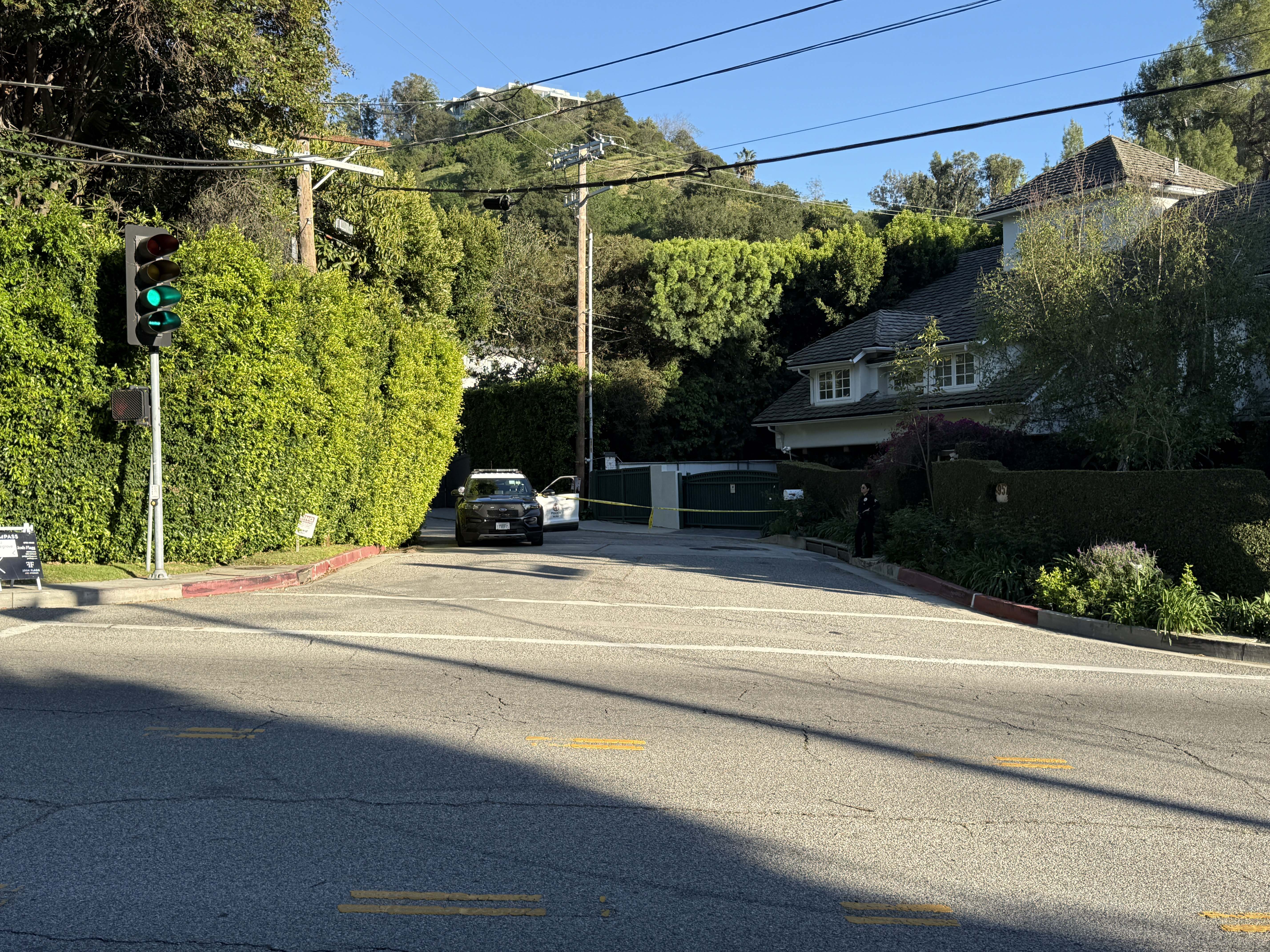 Police are seen outside Rihanna's home after a report of gunshots on March 08, 2026 in Beverly Hills, California. | Source: Getty Images