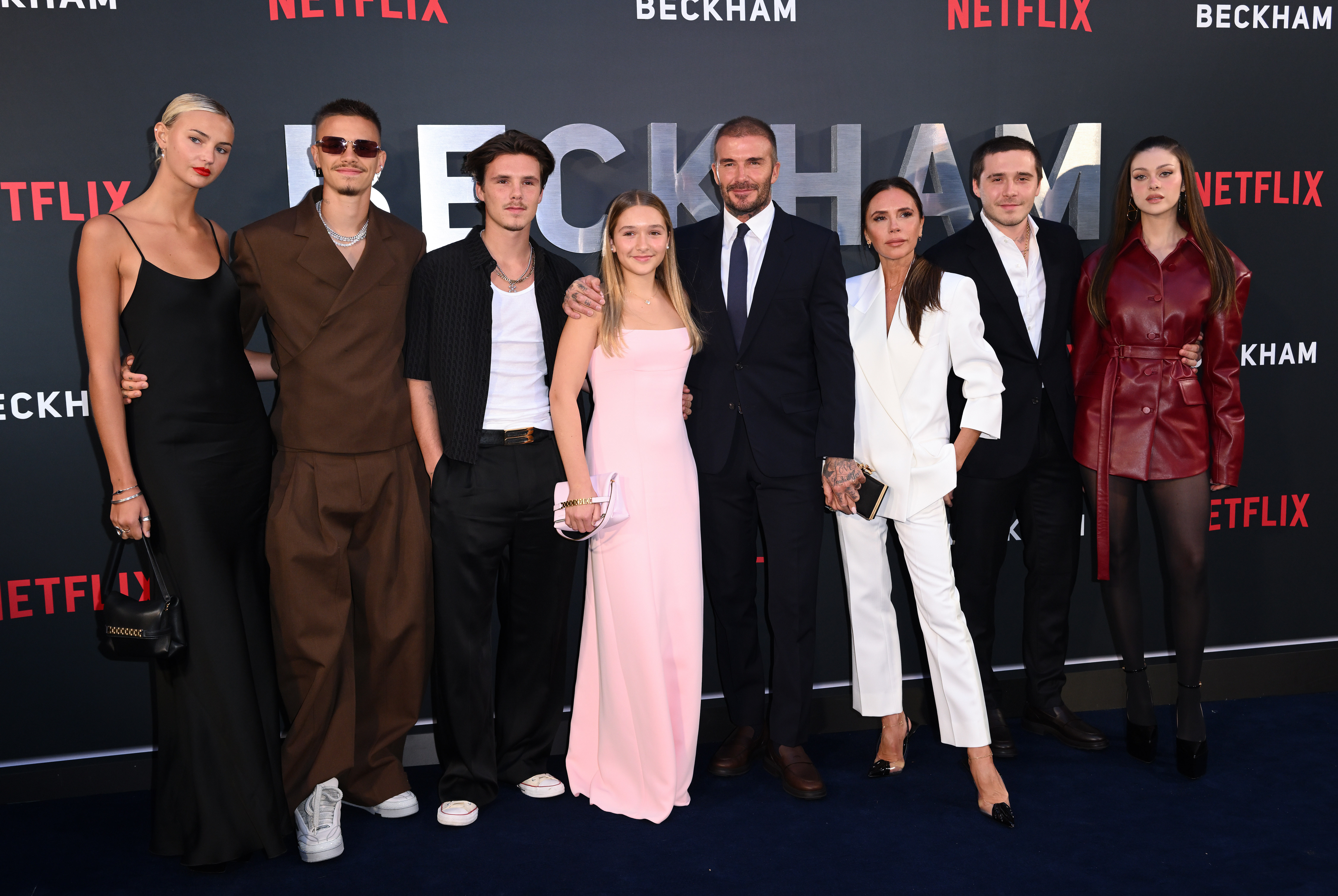 Mia Regan, Romeo Beckham, Cruz Beckham, Harper Beckham, David Beckham, Victoria Beckham, Brooklyn Beckham and Nicola Peltz attend the Netflix "Beckham" UK Premiere at The Curzon Mayfair on October 03, 2023 in London, England. | Source: Getty Images