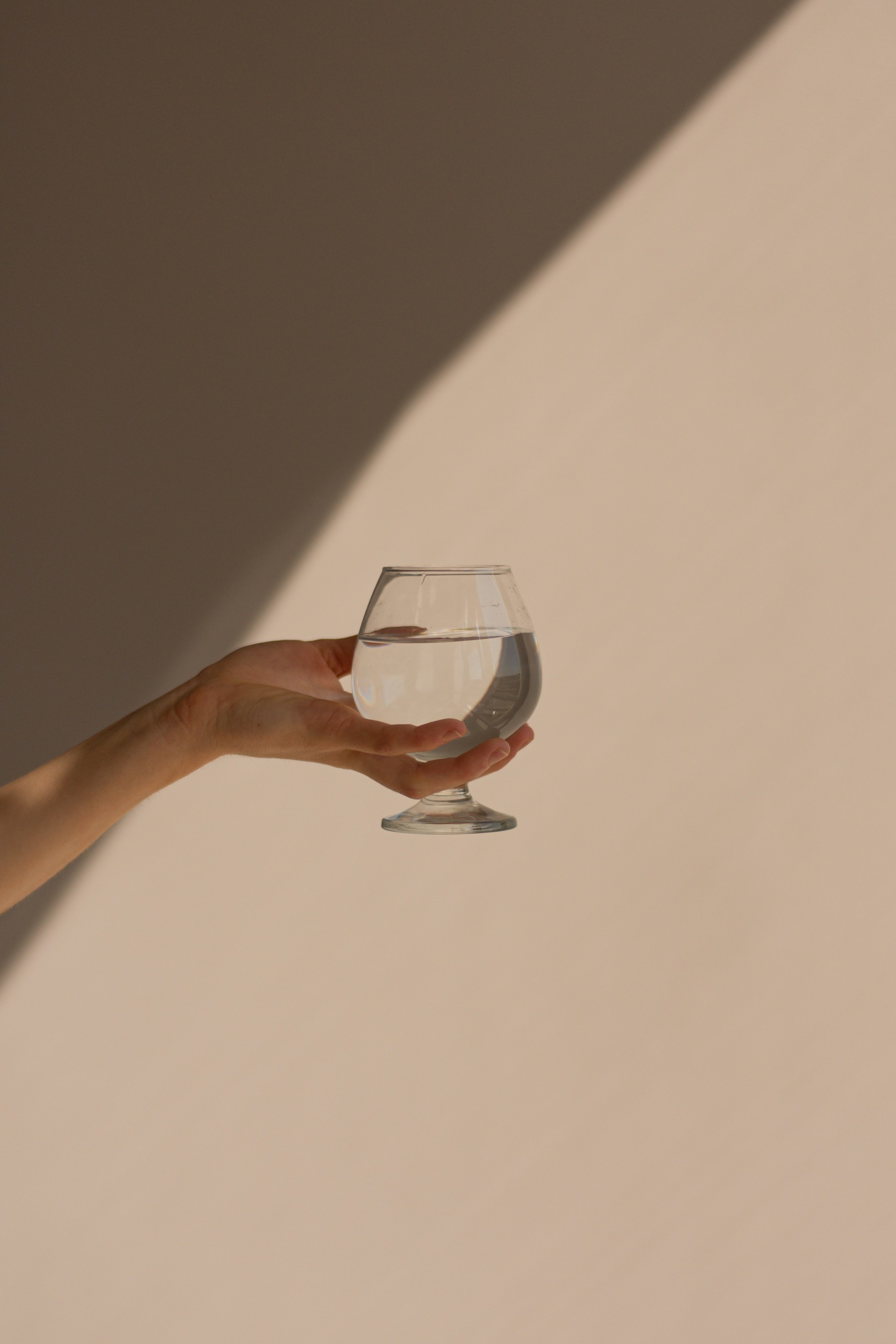 A woman holding a glass | Source: Unsplash