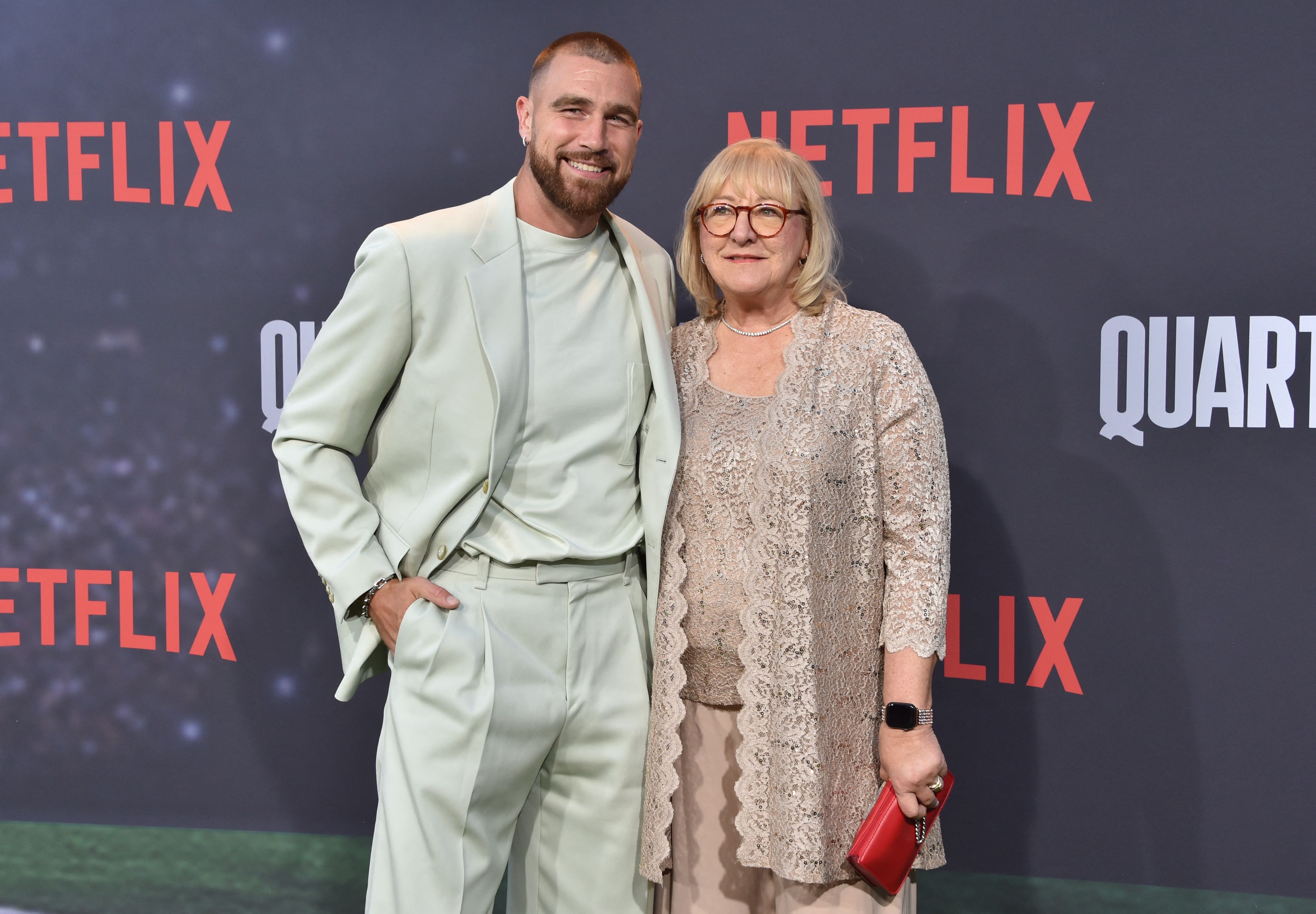 Travis Kelce and his mom, Donna Kelce, arrive for the premiere of Netflix's docuseries "Quarterback" at the Tudum Theatre on July 11, 2023, in Los Angeles. | Source: Getty Images
