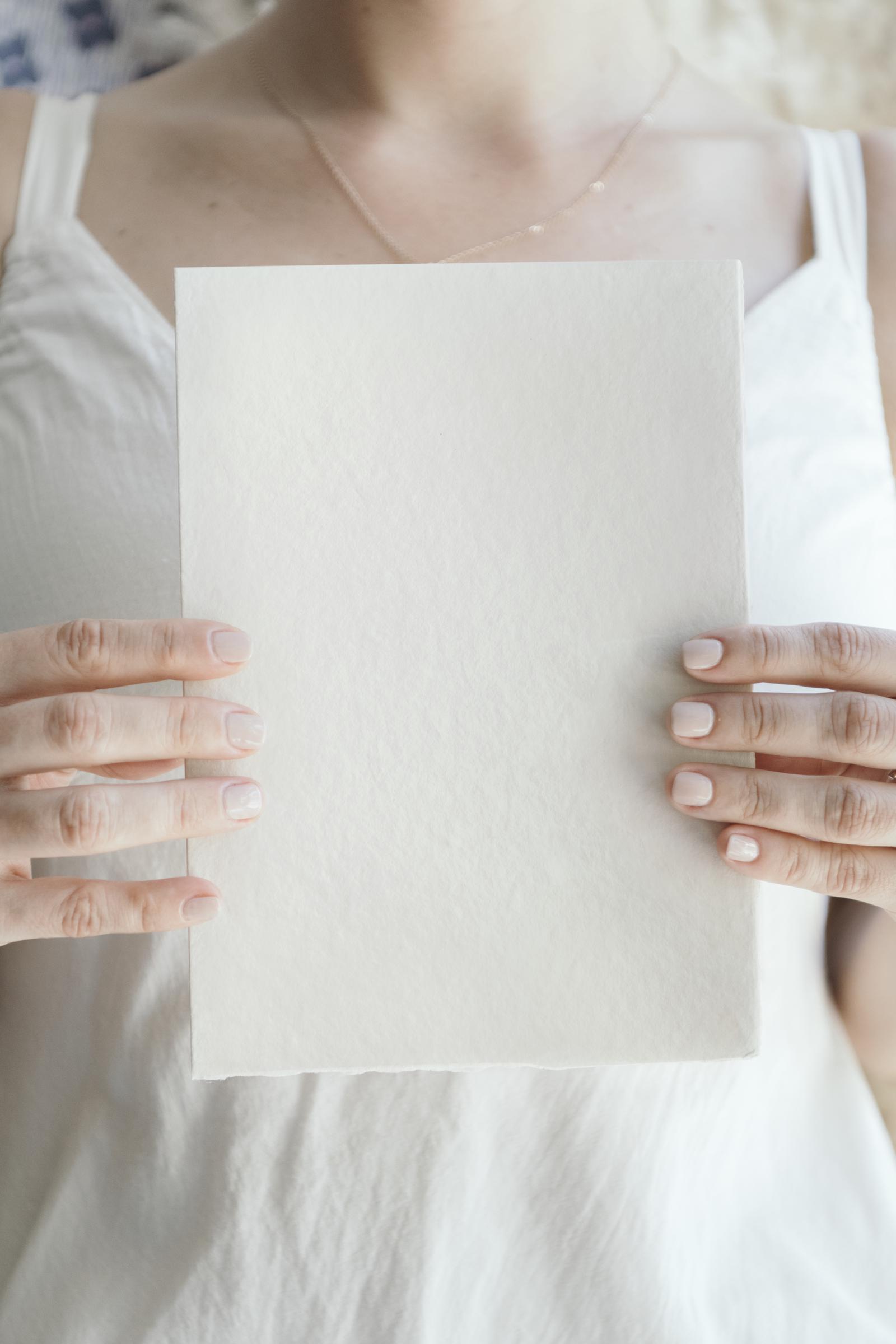 A woman holding a letter | Source: Freepik