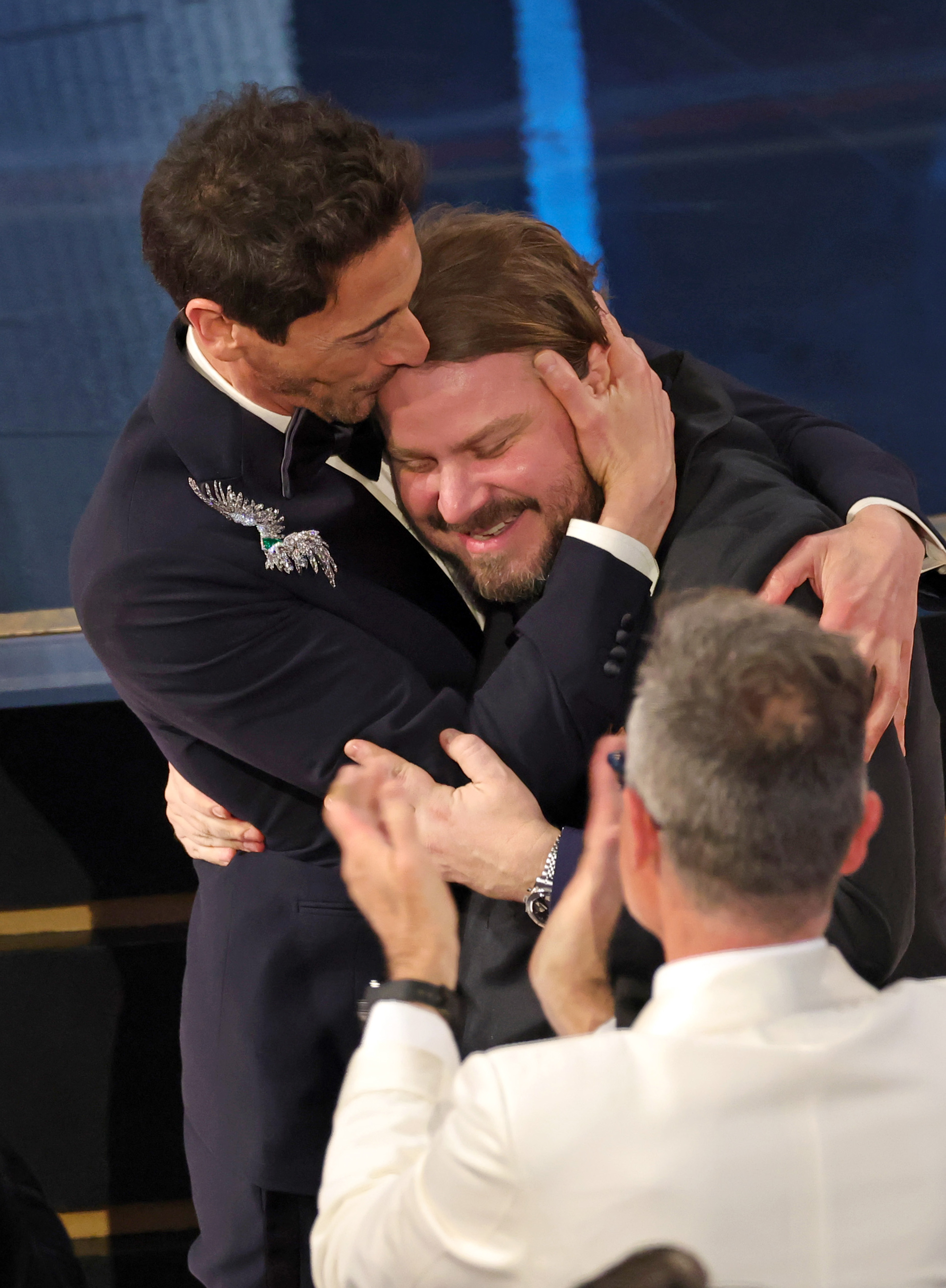 Adrien Brody with Brady Corbet as he accepts the Best Actor In A Leading Role award for "The Brutalist" during the 97th Annual Oscars at Dolby Theatre on March 02, 2025 in Hollywood, California | Source: Getty Images
