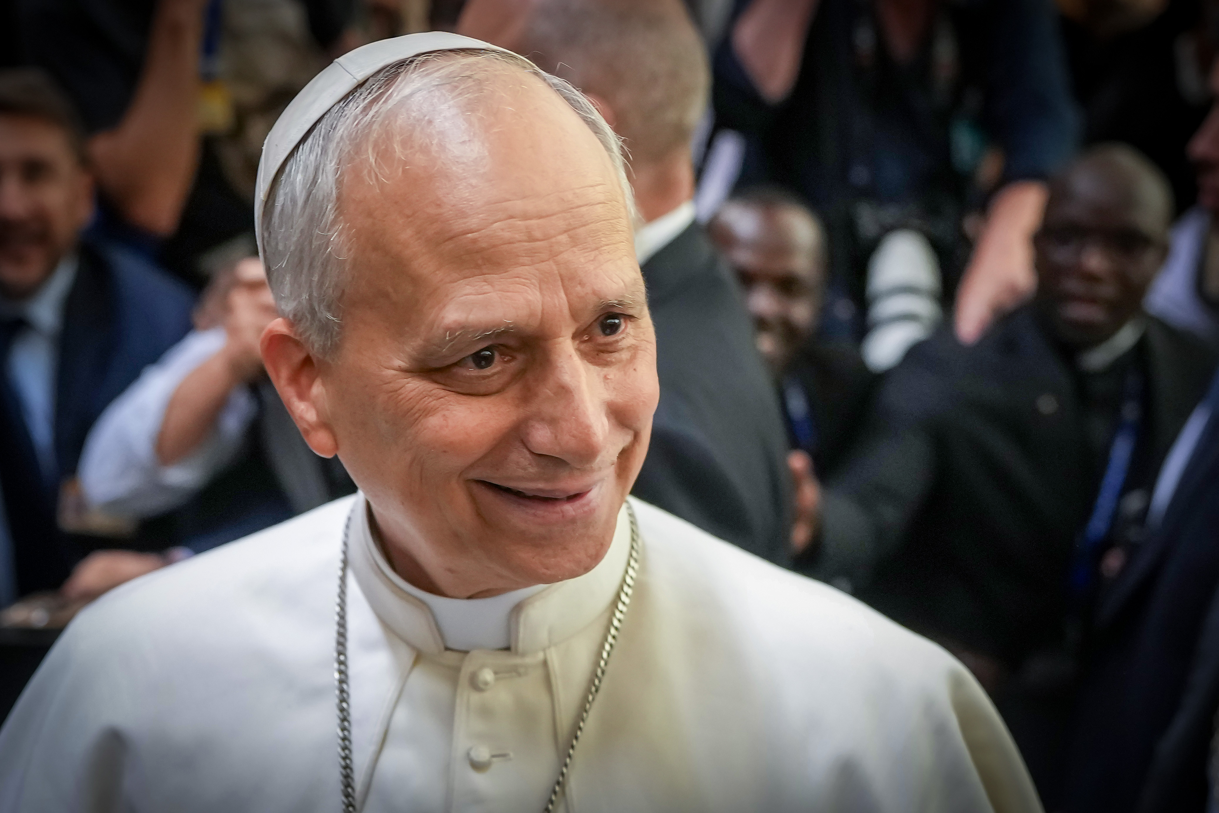 Pope Leo XIV shakes the hands and greets people of the press after an audience with thousands of journalists and media workers on May 12, 2025, at Paul VI Hall in Vatican City, Vatican. | Source: Getty Images