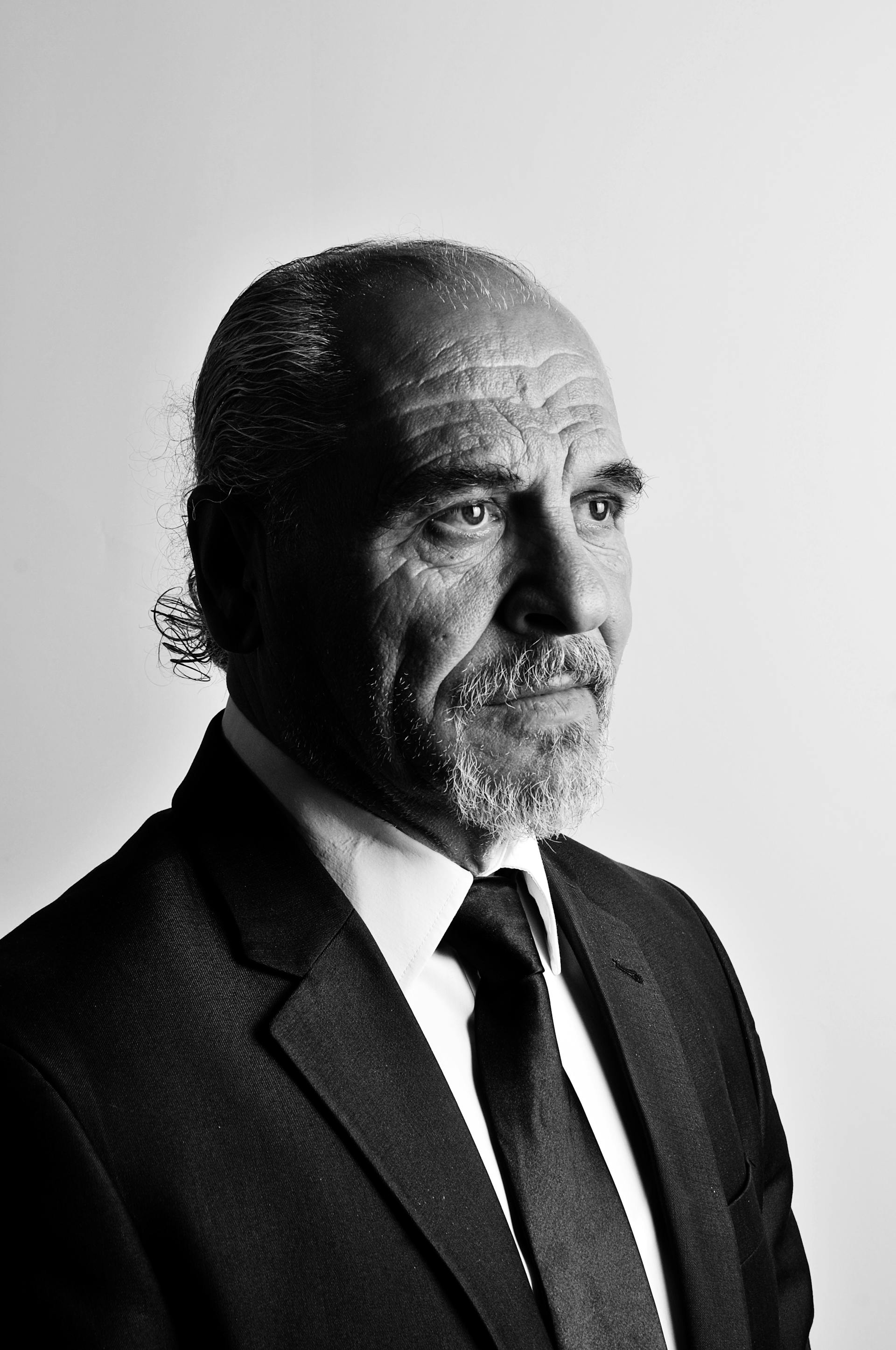 A middle-aged man, nicely dressed, staring coldly at something | Source: Pexels