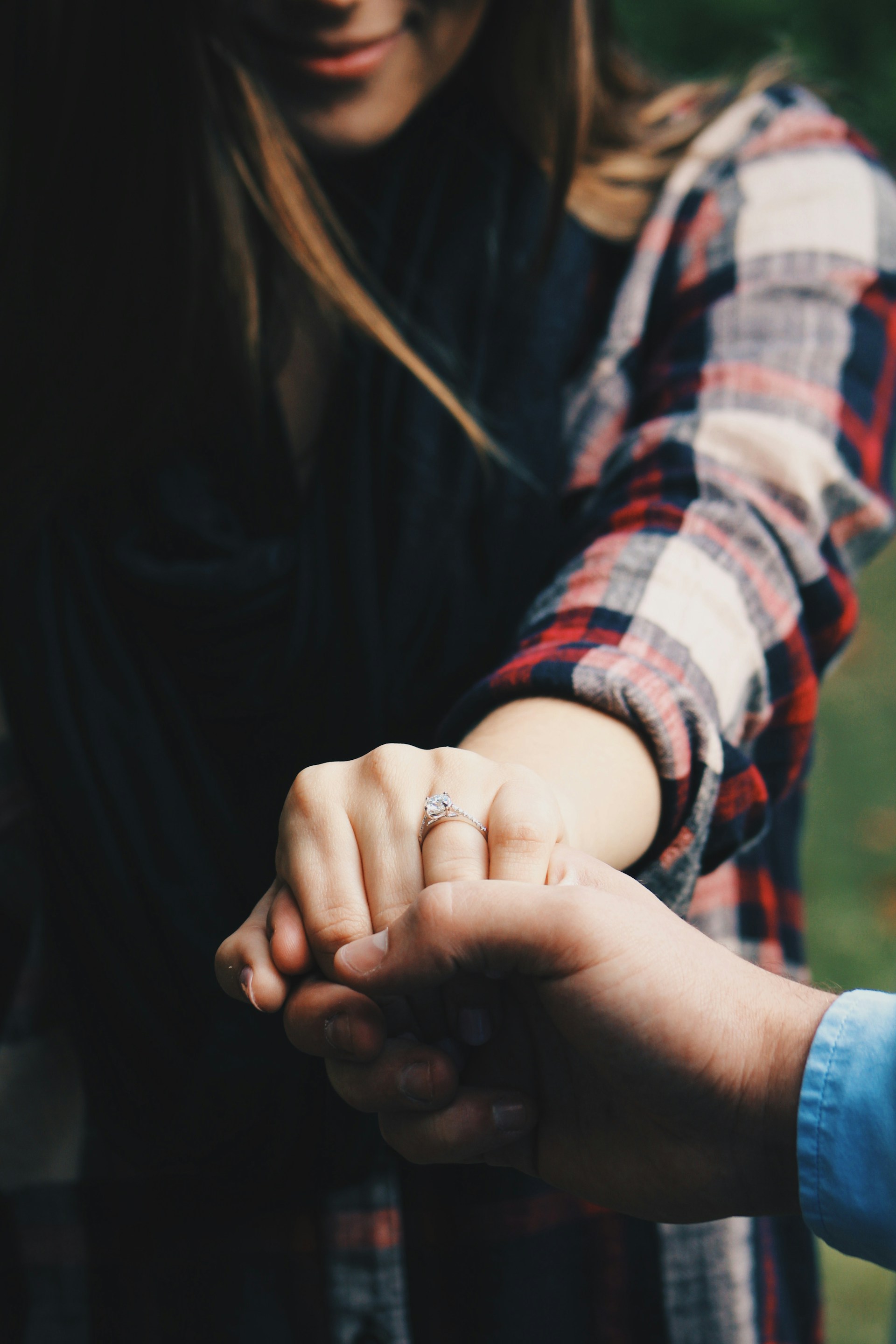 A woman holding a man's hand | Source: Unsplash