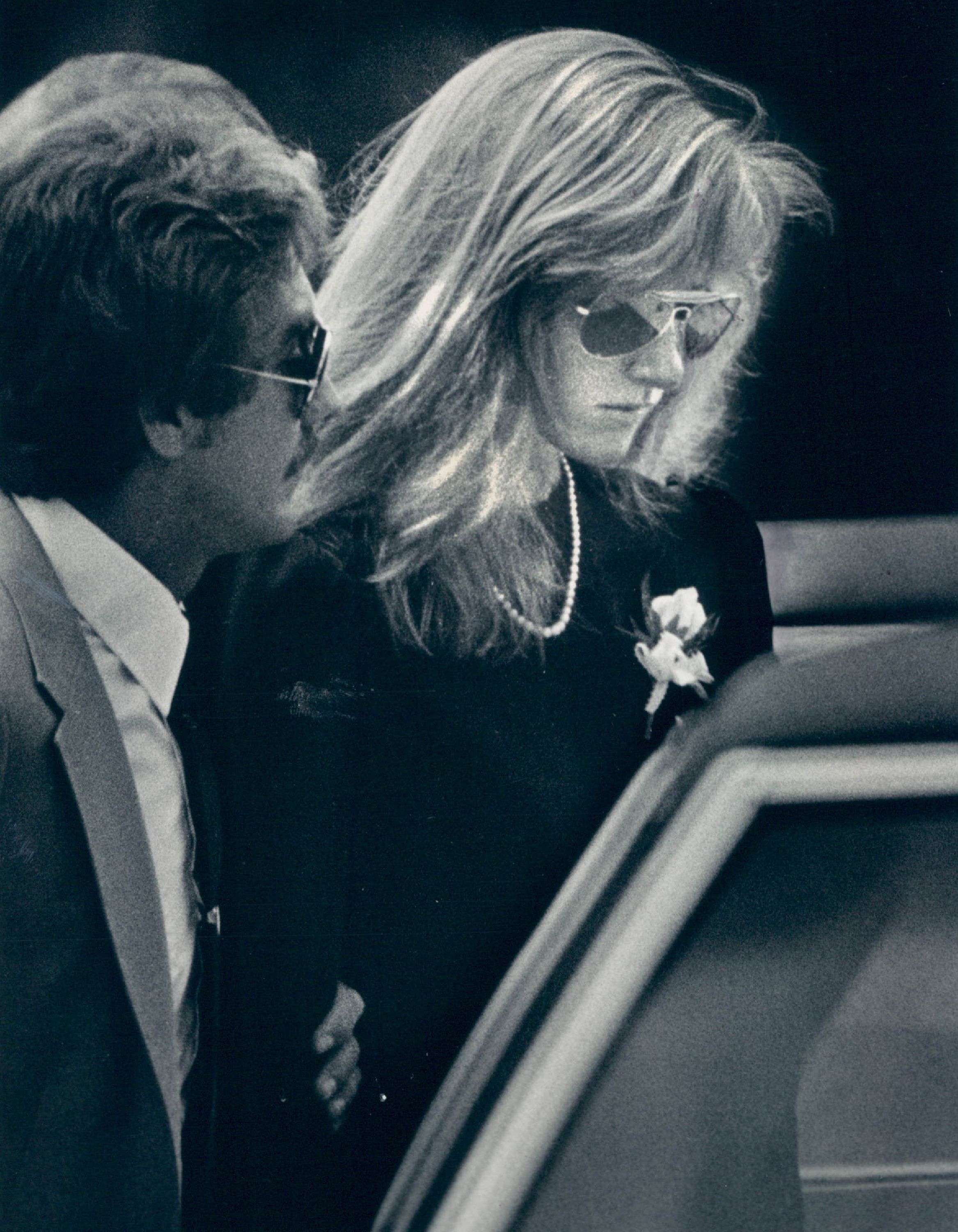 Robert Redford and Shauna Redford are photographed the funeral service of Sid Wells on August 5, 1983, in Longmong, Colorado. | Source: Getty Images