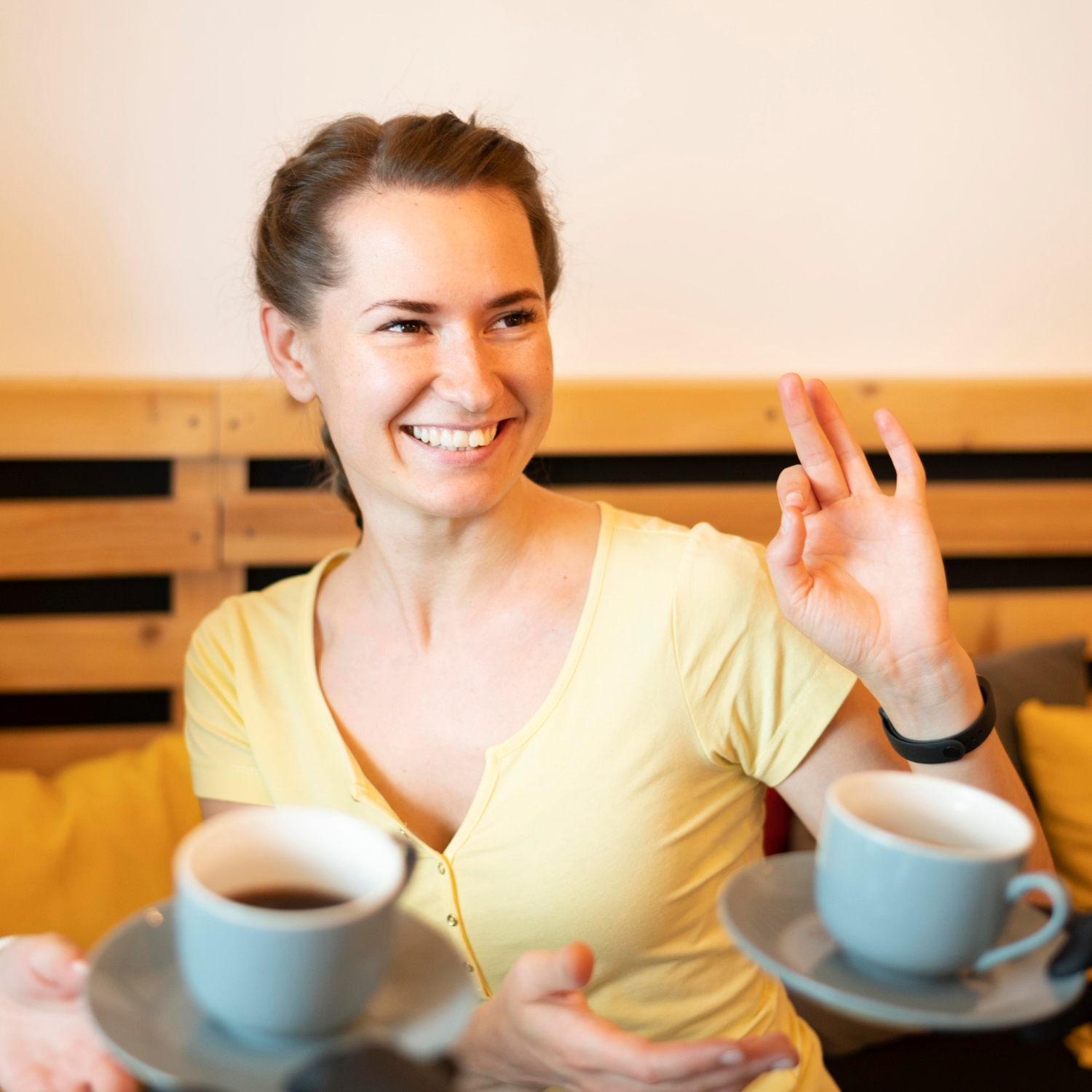 A cheerful woman making a hand gesture | Source: Freepik