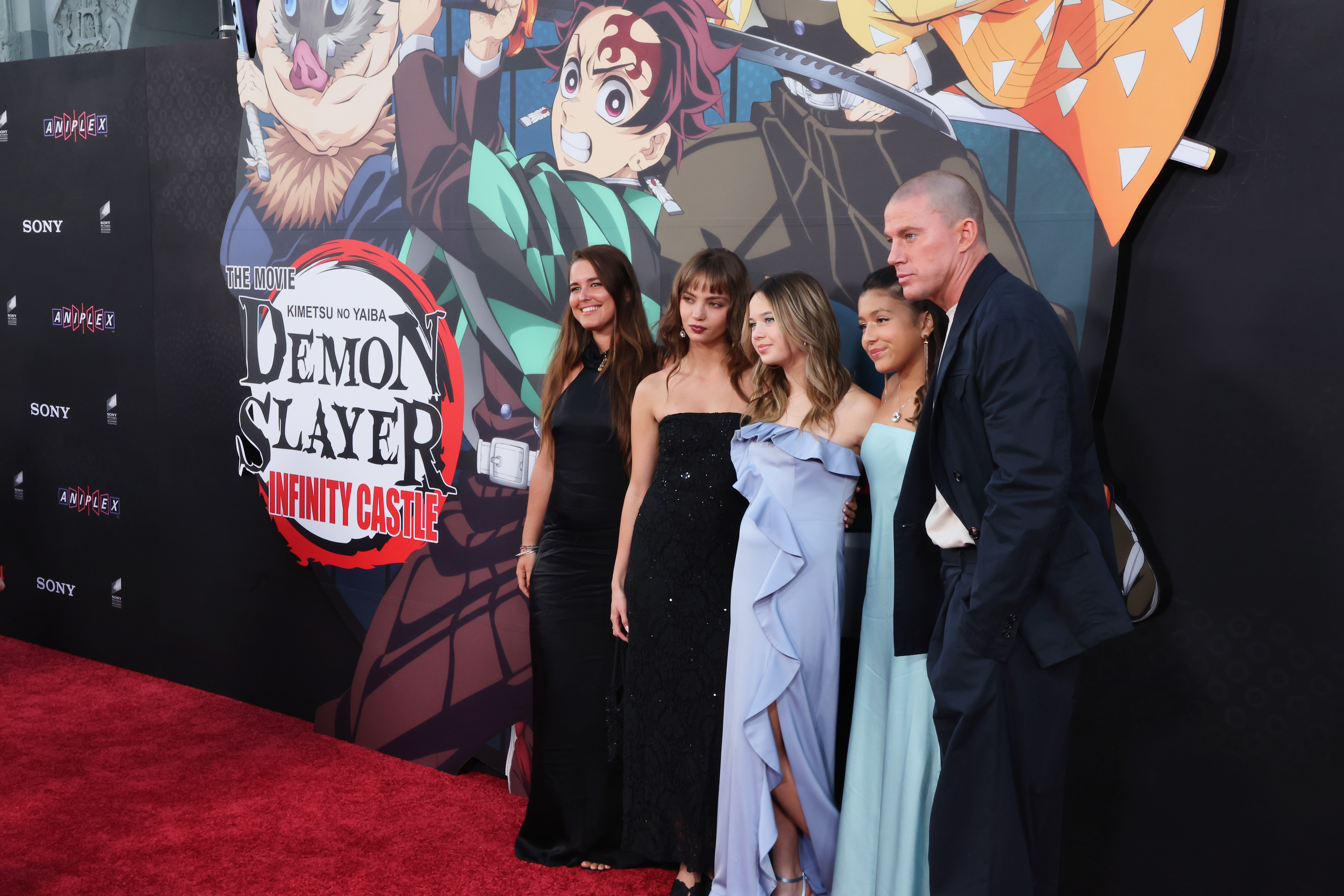 Inka Williams and Channing Tatum made their official red carpet debut at a Los Angeles premiere on Tuesday, with Williams (second from left) and Channing’s daughter Everly (center) posing side-by-side in a group photo. | Source: Getty Images