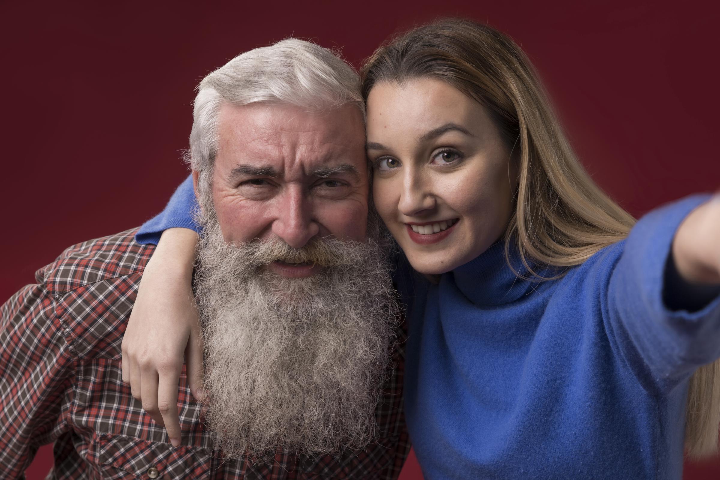 A happy granddaughter with her grandfather | Source: Freepik