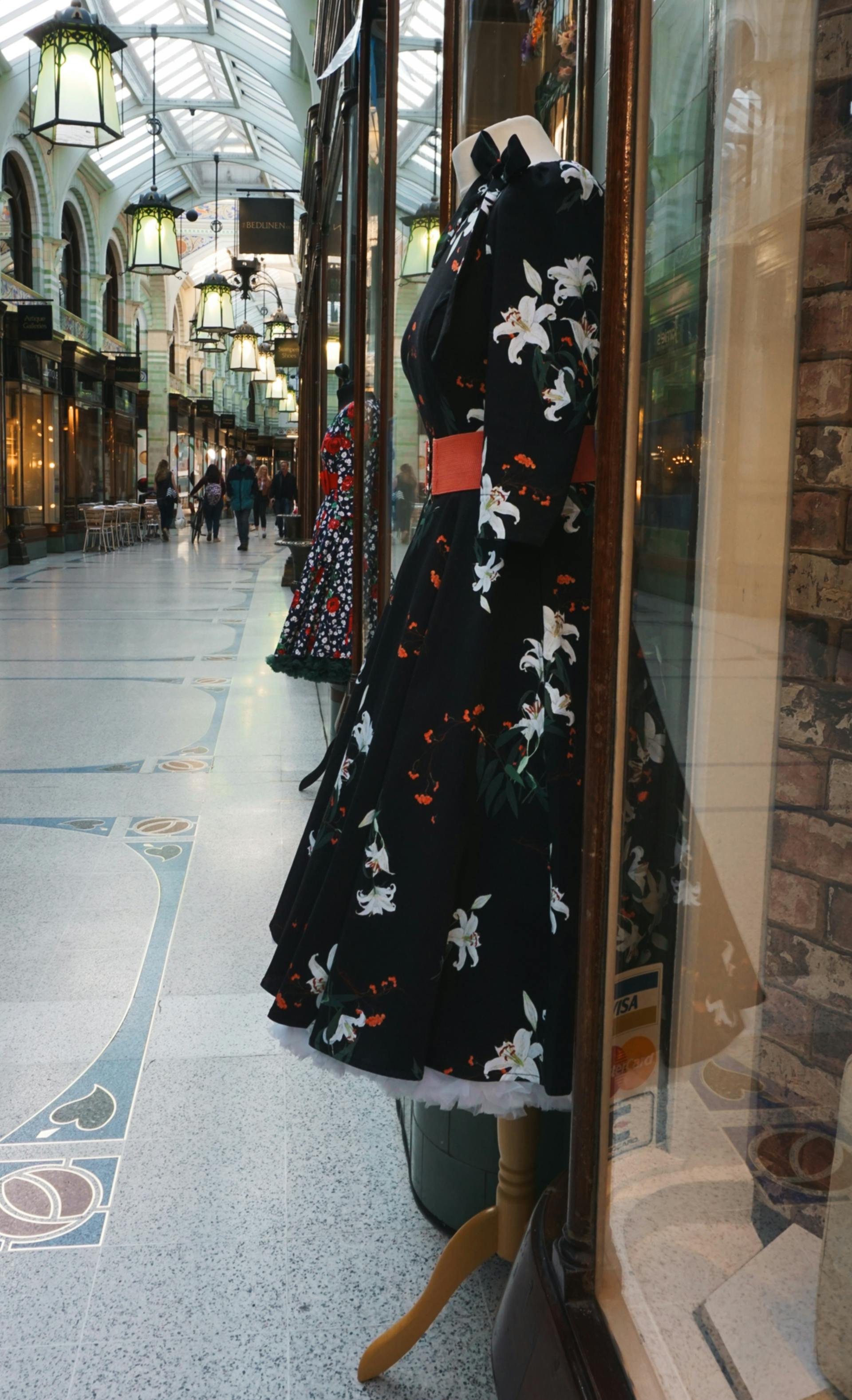 Dresses on display outside a store in a mall | Source: Pexels