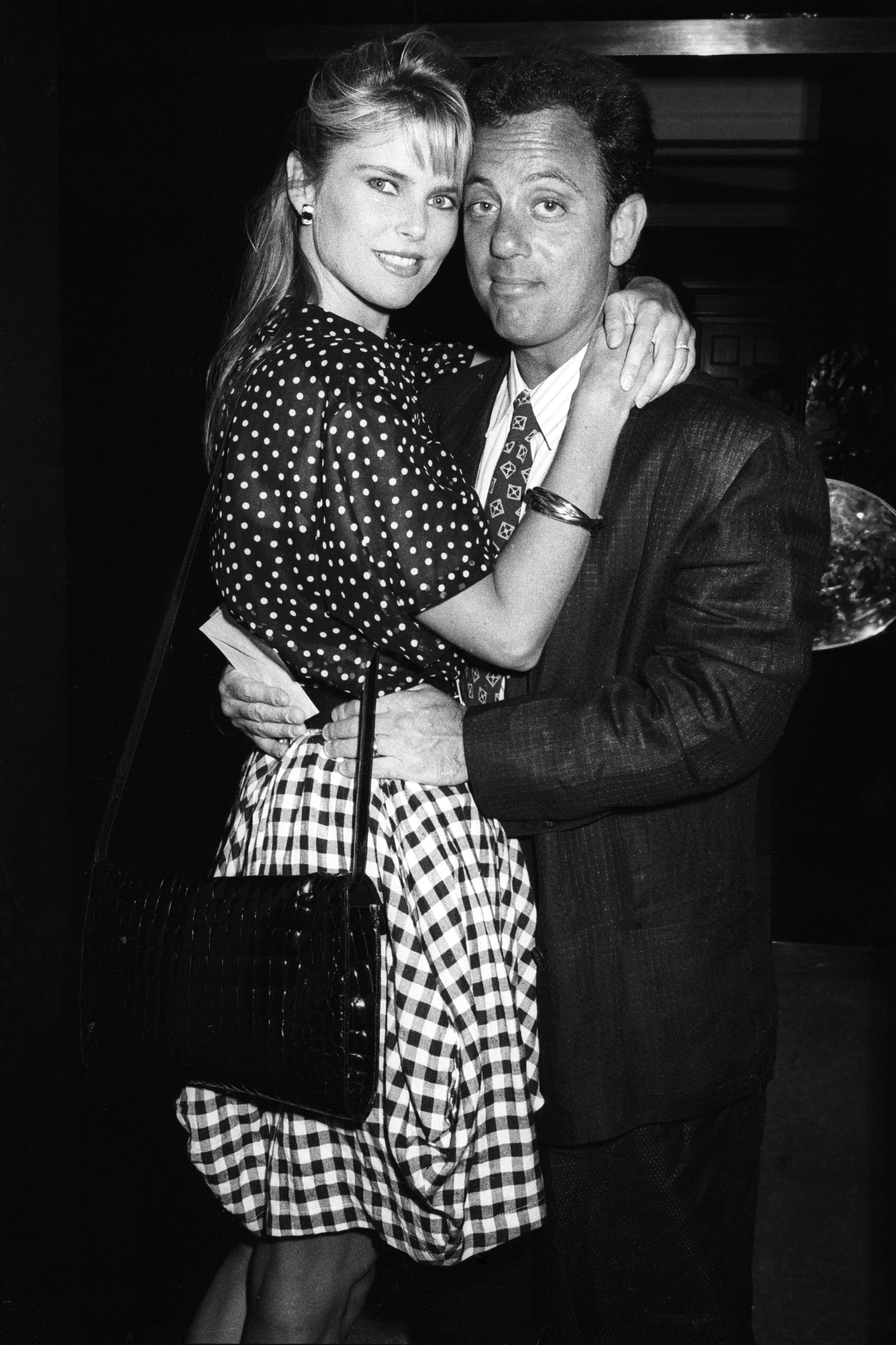 Christie Brinkley and Billy Joel are seen at Langan's Brasserie on July 4, 1987, in London, United Kingdom. | Source: Getty Images
