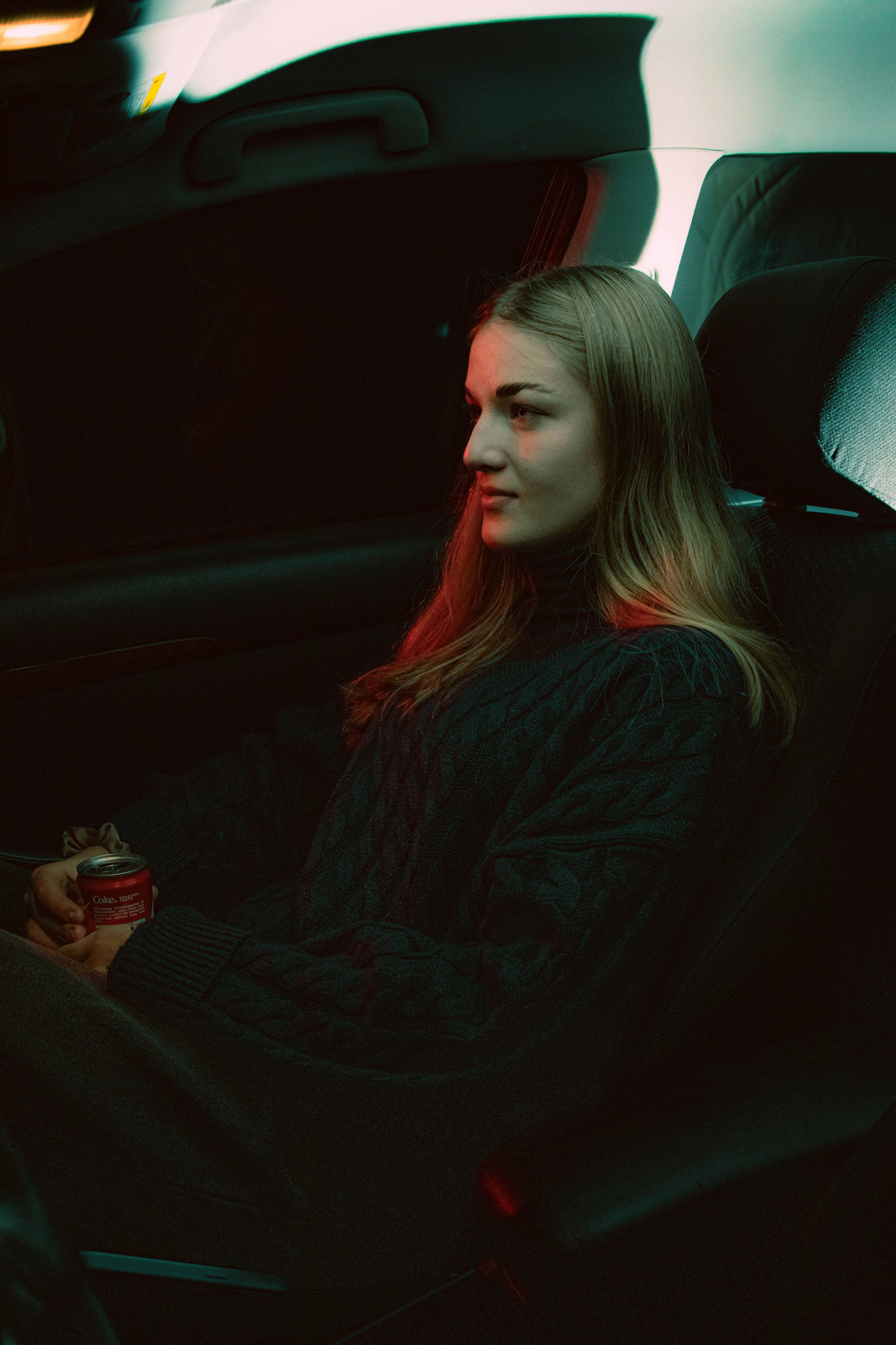 A woman sitting in a car | Source: Unsplash