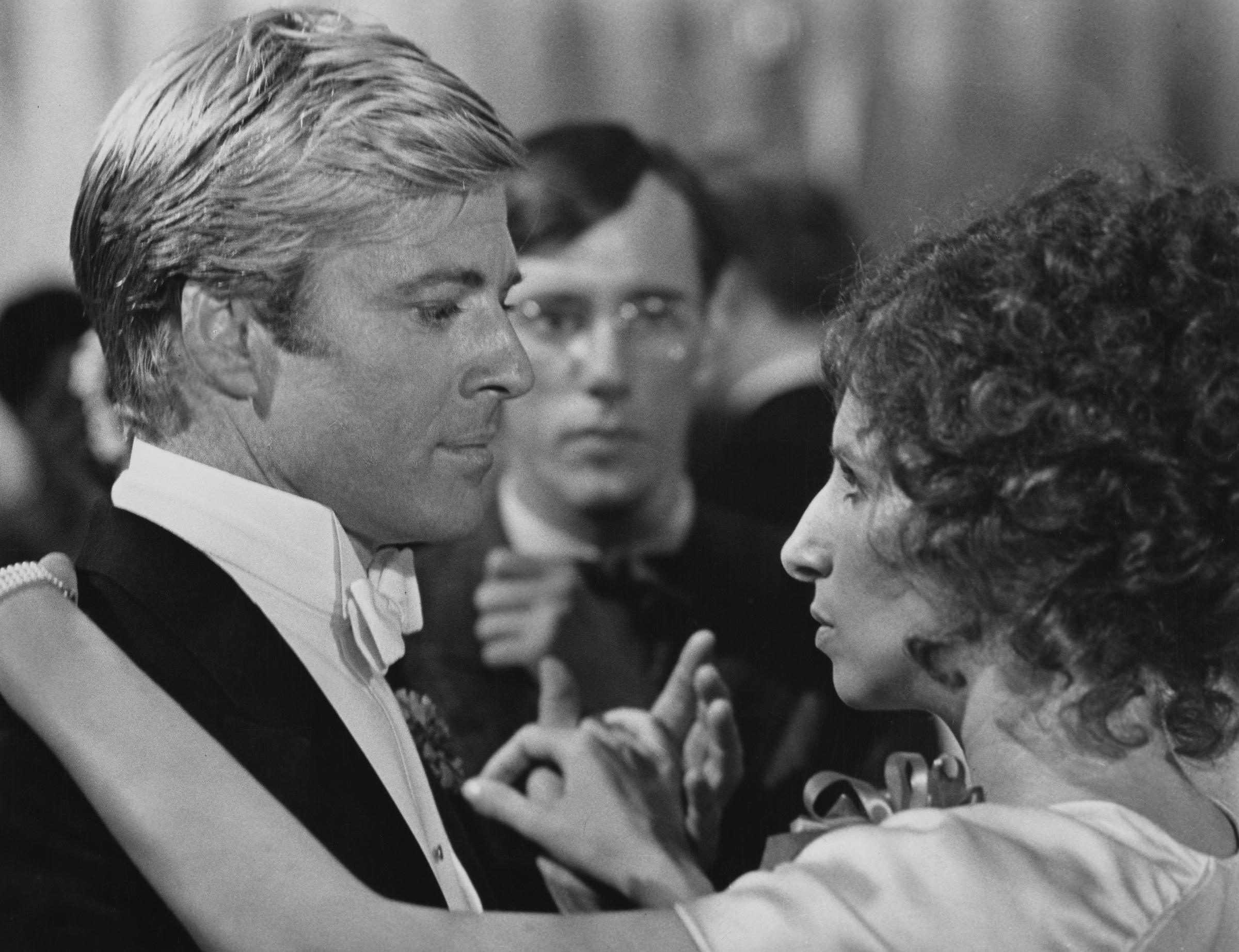 Robert Redford and Barbra Streisand dance in a publicity still for the romantic drama "The Way We Were," circa 1973. | Source: Getty Images