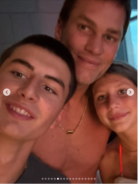 Former NFL quarterback Tom Brady poses for a selfie with his children while on vacation, from a posted dated June 29, 2025 | Source: Instagram/tombrady
