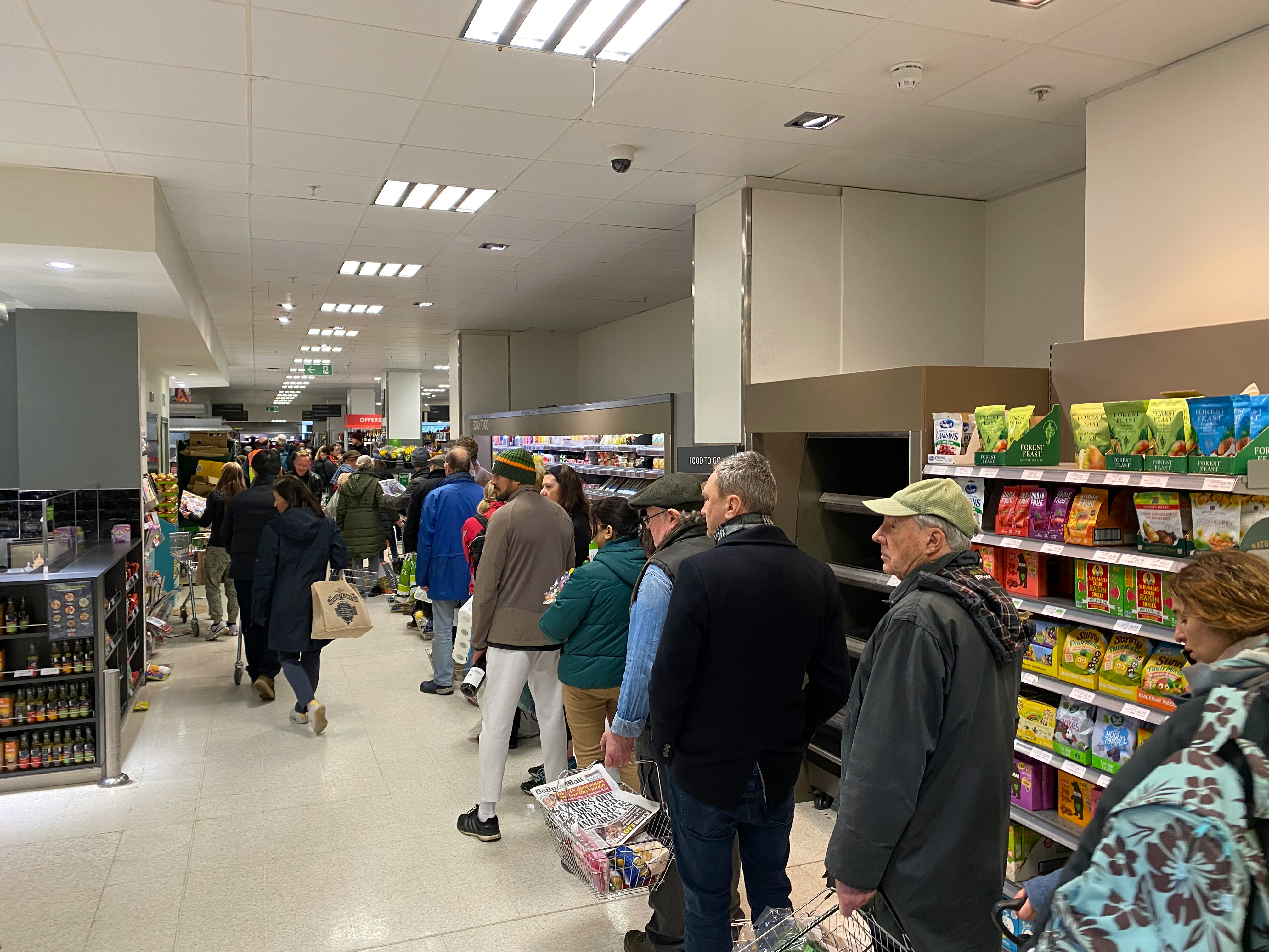 People standing in line at a grocery store | Source: Unsplash