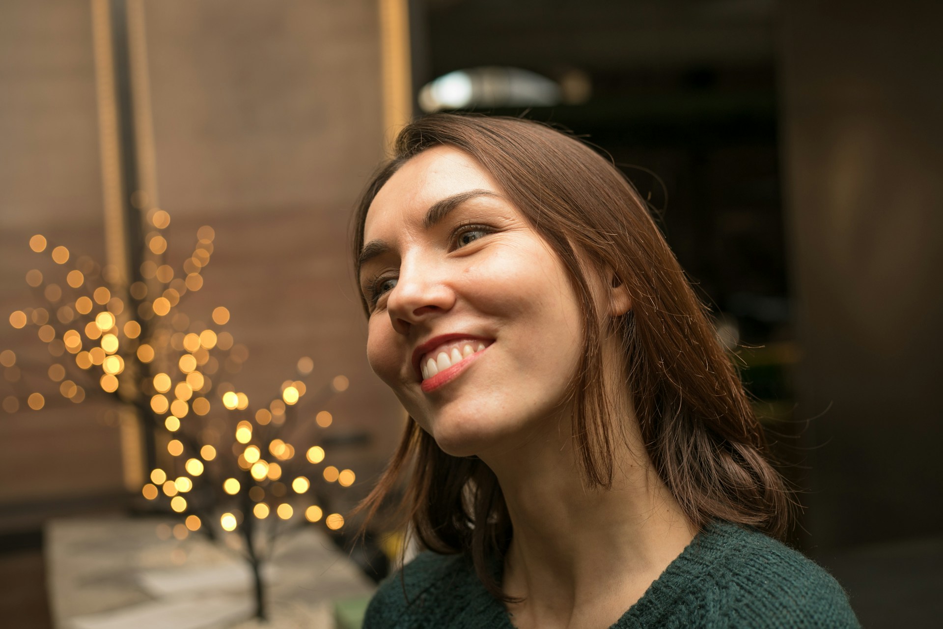 A woman smiling at someone | Source: Unsplash