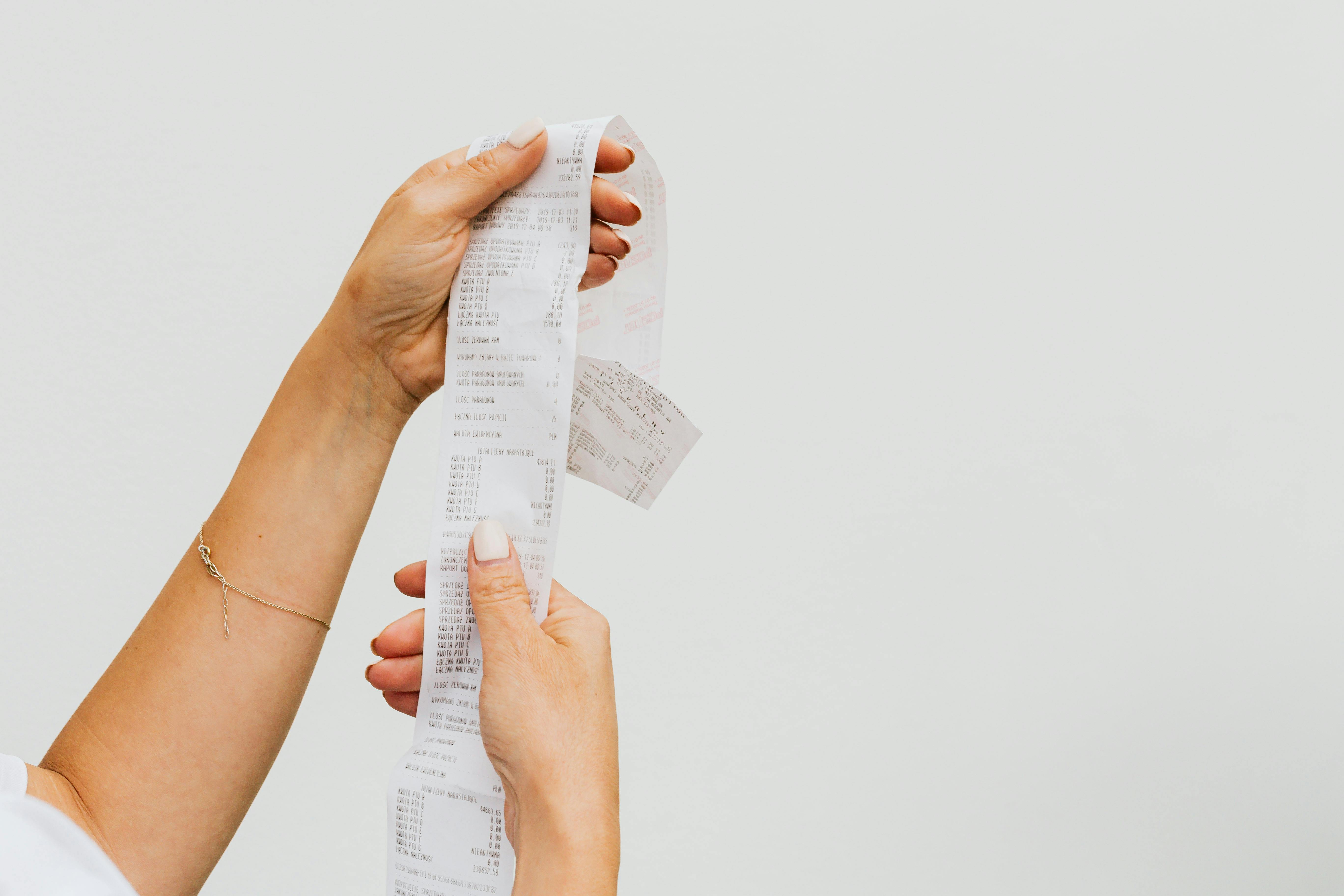 A person holding a receipt | Source: Pexels