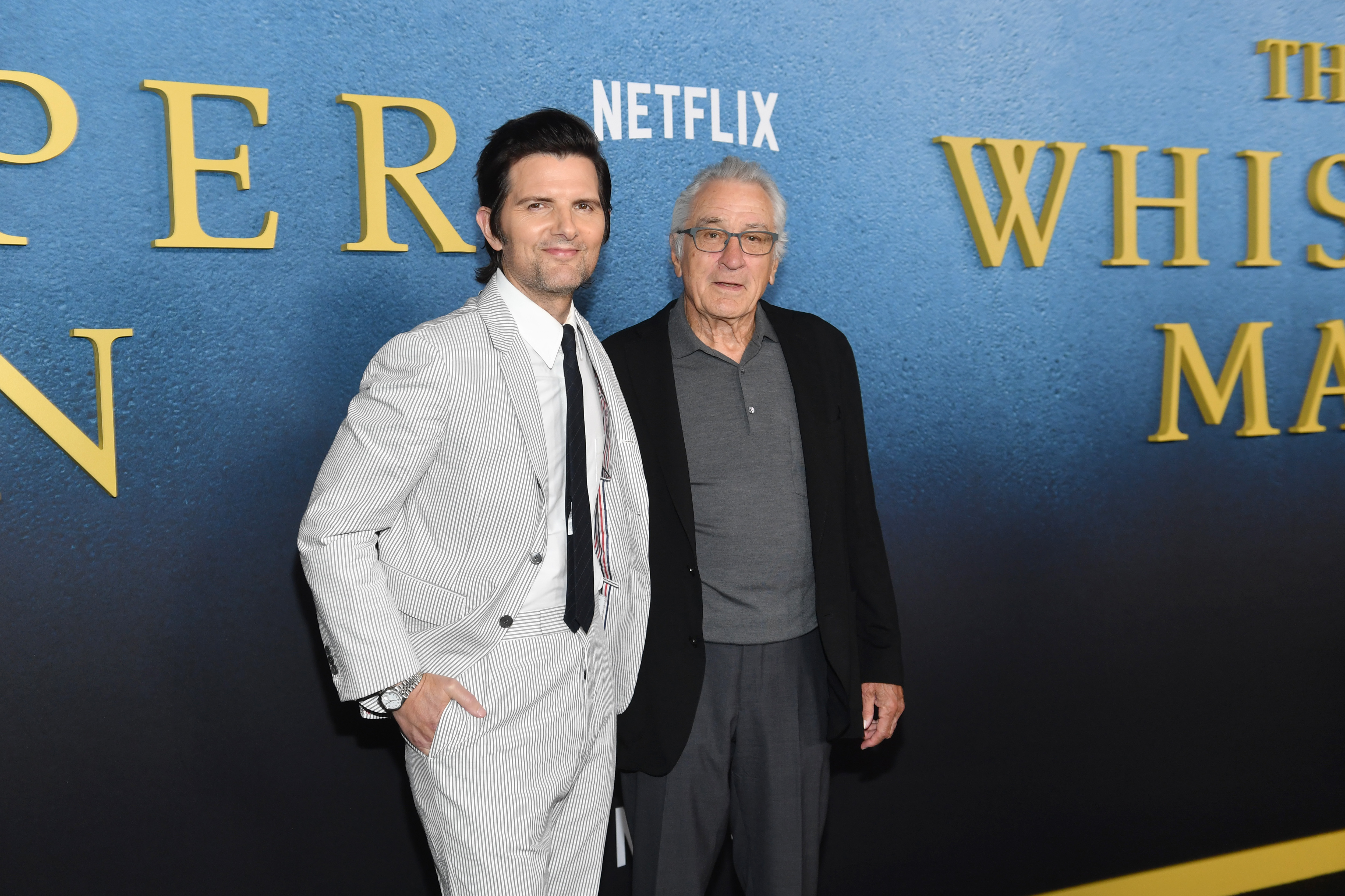 Adam Scott and Robert De Niro attend the premiere of Netflix's "The Whisper Man" on August 24, 2026 in New York City. | Source: Getty Images