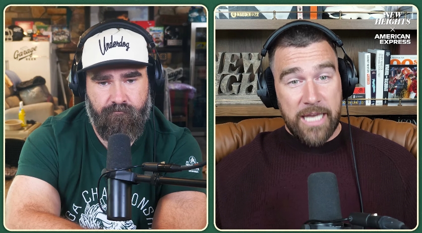 Jason and Travis Kelce react during a conversation about Travis' recent London trip with Taylor Swift on the "New Heights" podcast. | Source: YouTube/ New Heights