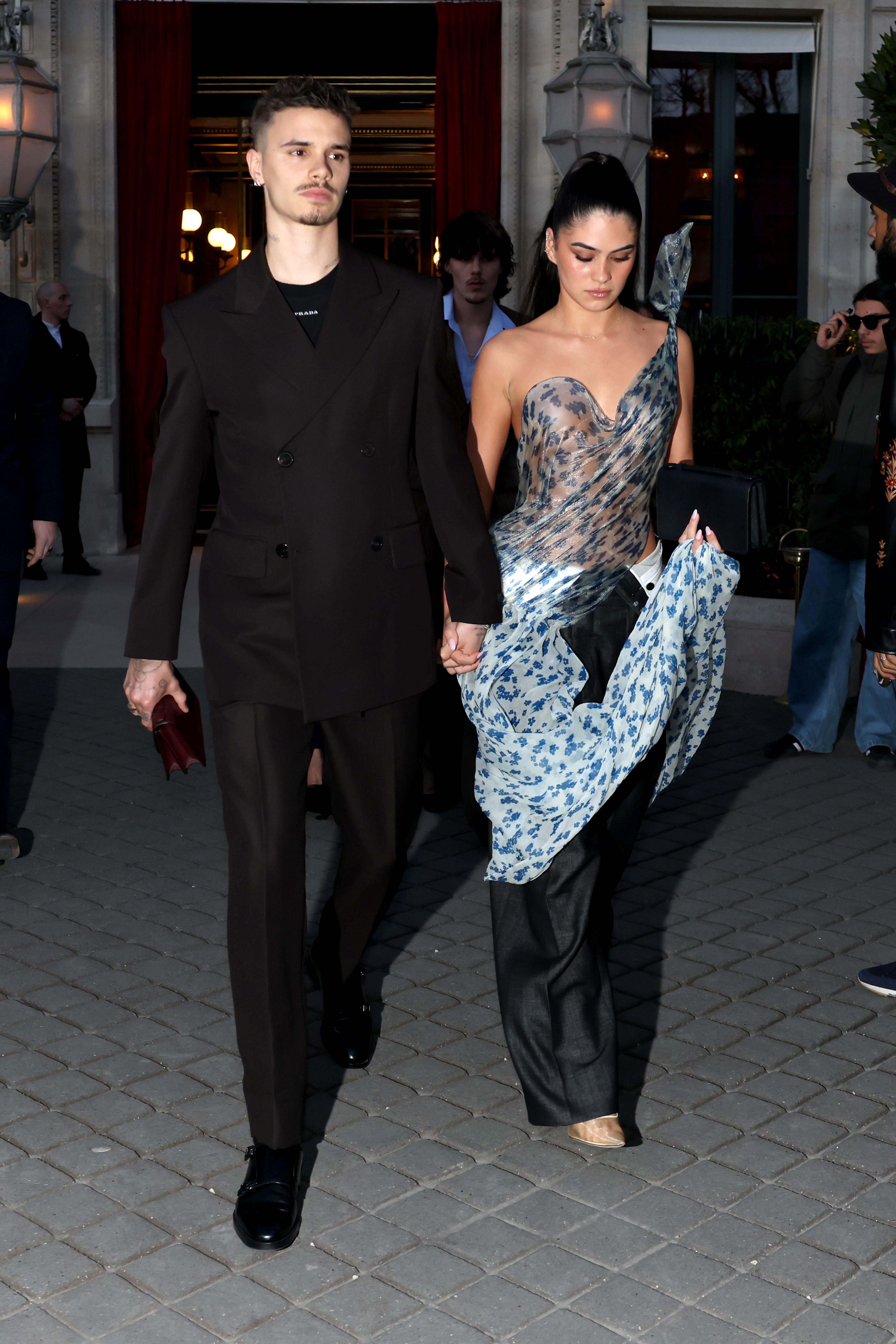Romeo Beckham and Kim Turnbull are seen during the Womenswear Fall/Winter 2025/2026 as part of Paris Fashion Week on March 7, 2025, in Paris, France. | Source: Getty Images