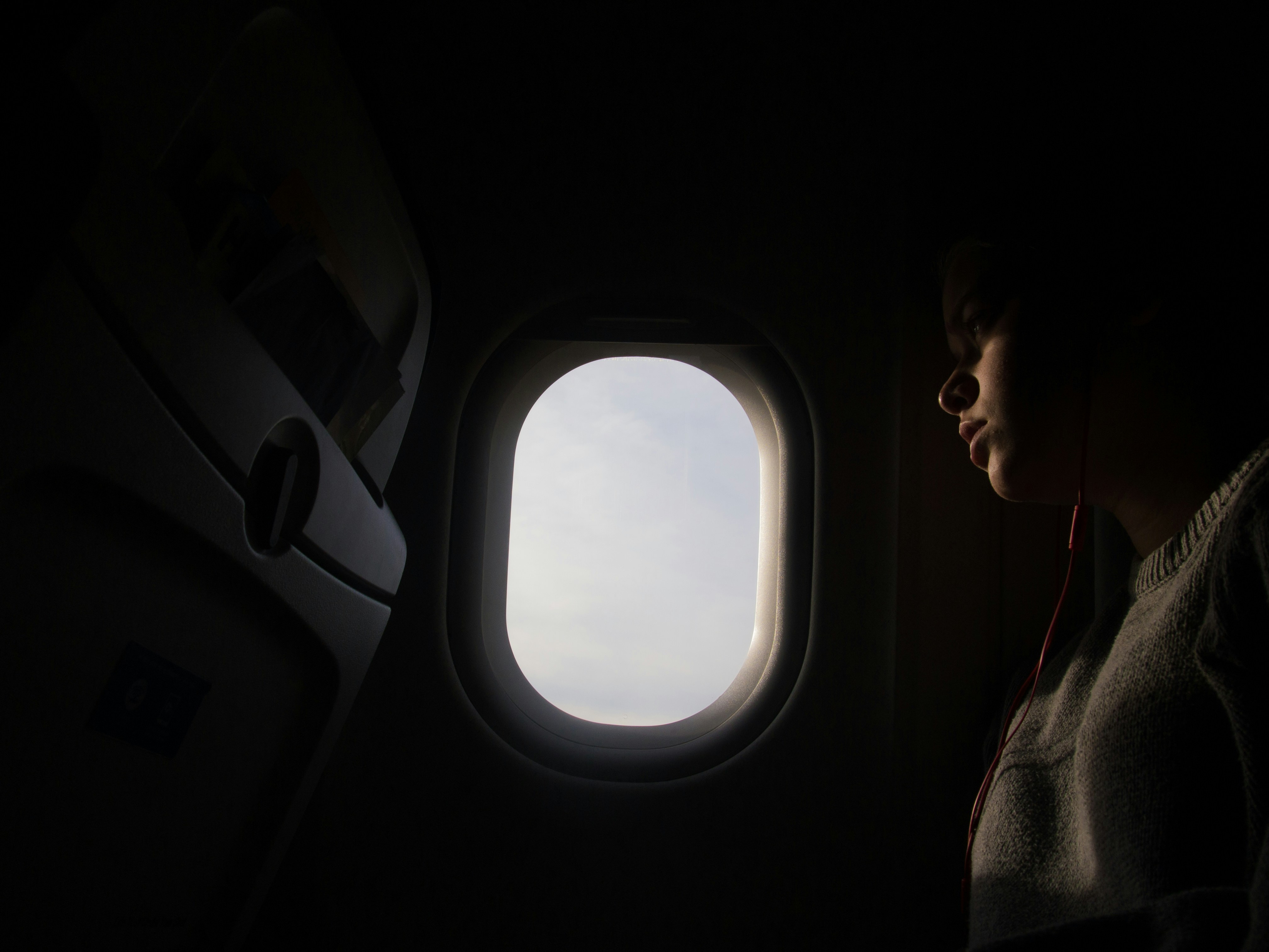 A person sitting in an airplane | Source: Unsplash