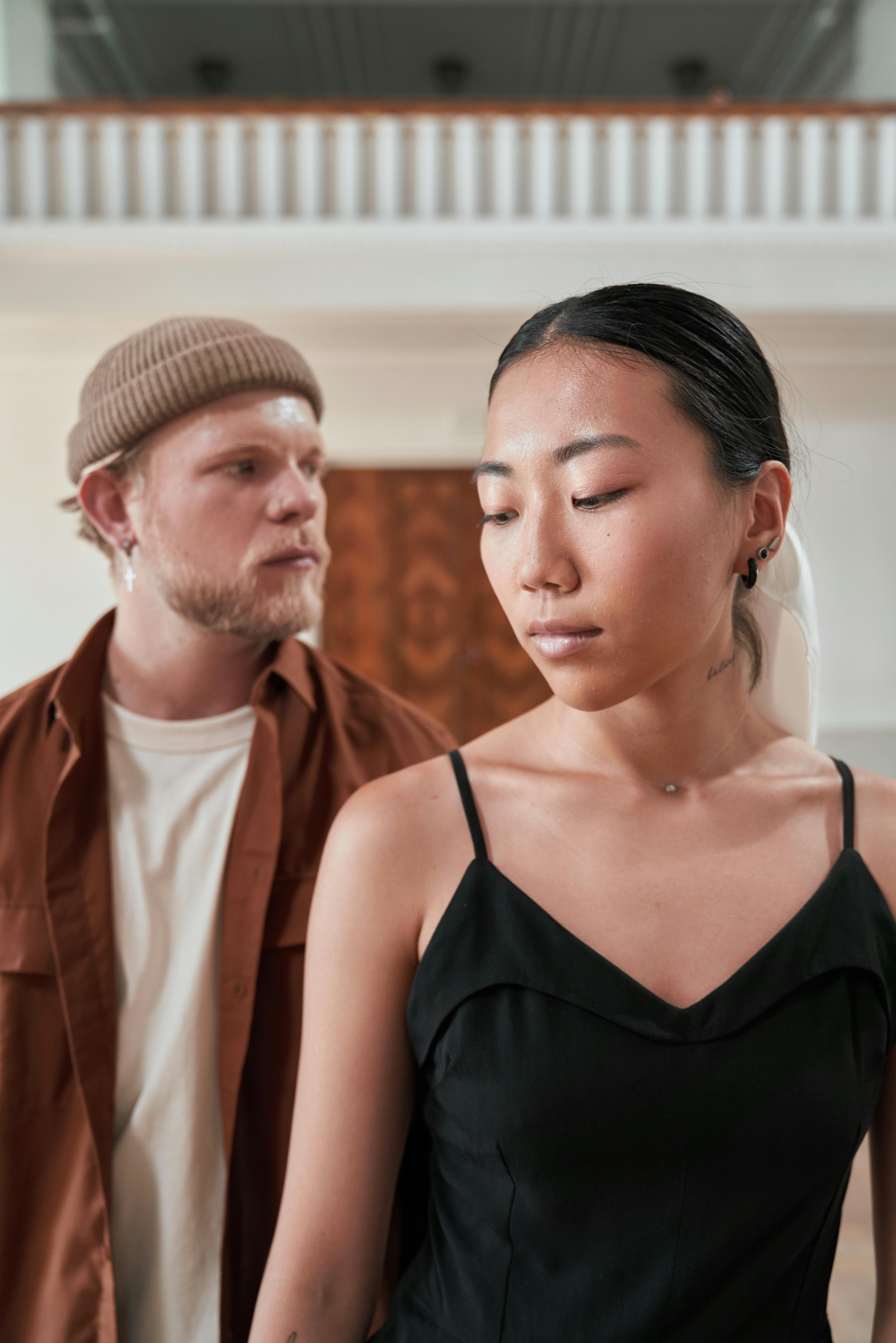 A man and a woman looking away | Source: Pexels
