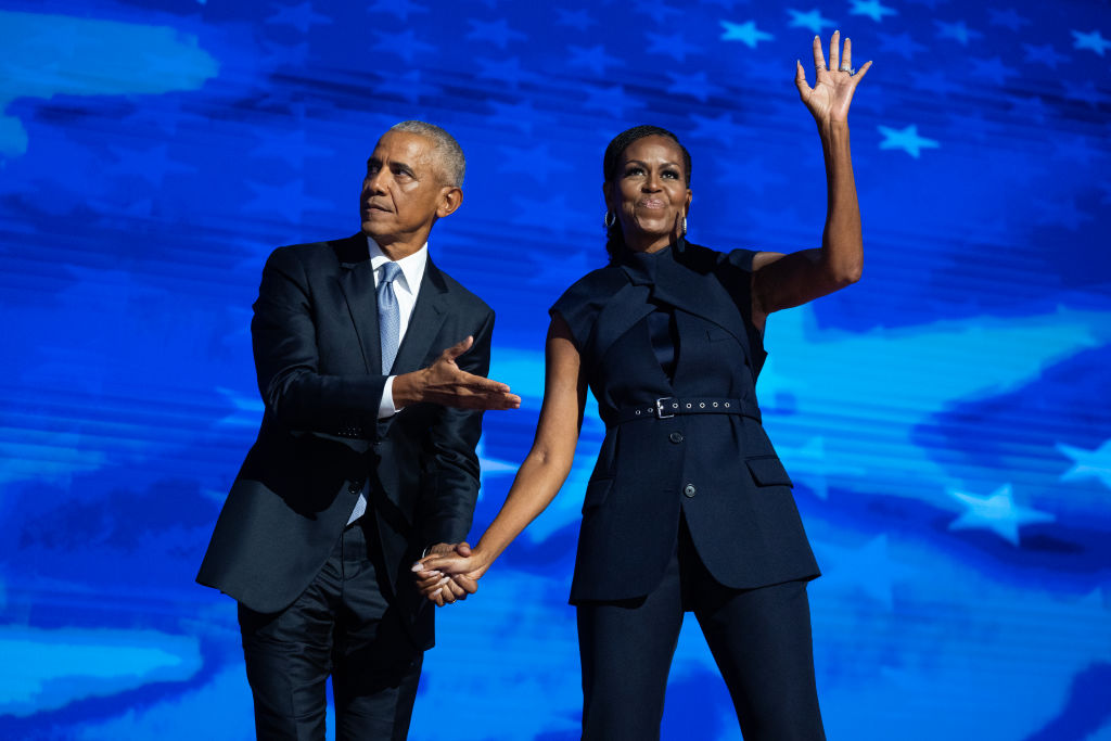 Former President Barack Obama and former First Lady Michelle Obama appear on stage in between their addresses on the second night of the Democratic National Convention at the United Center on August 20, 2024, in Chicago, Illinois. | Source: Getty Images