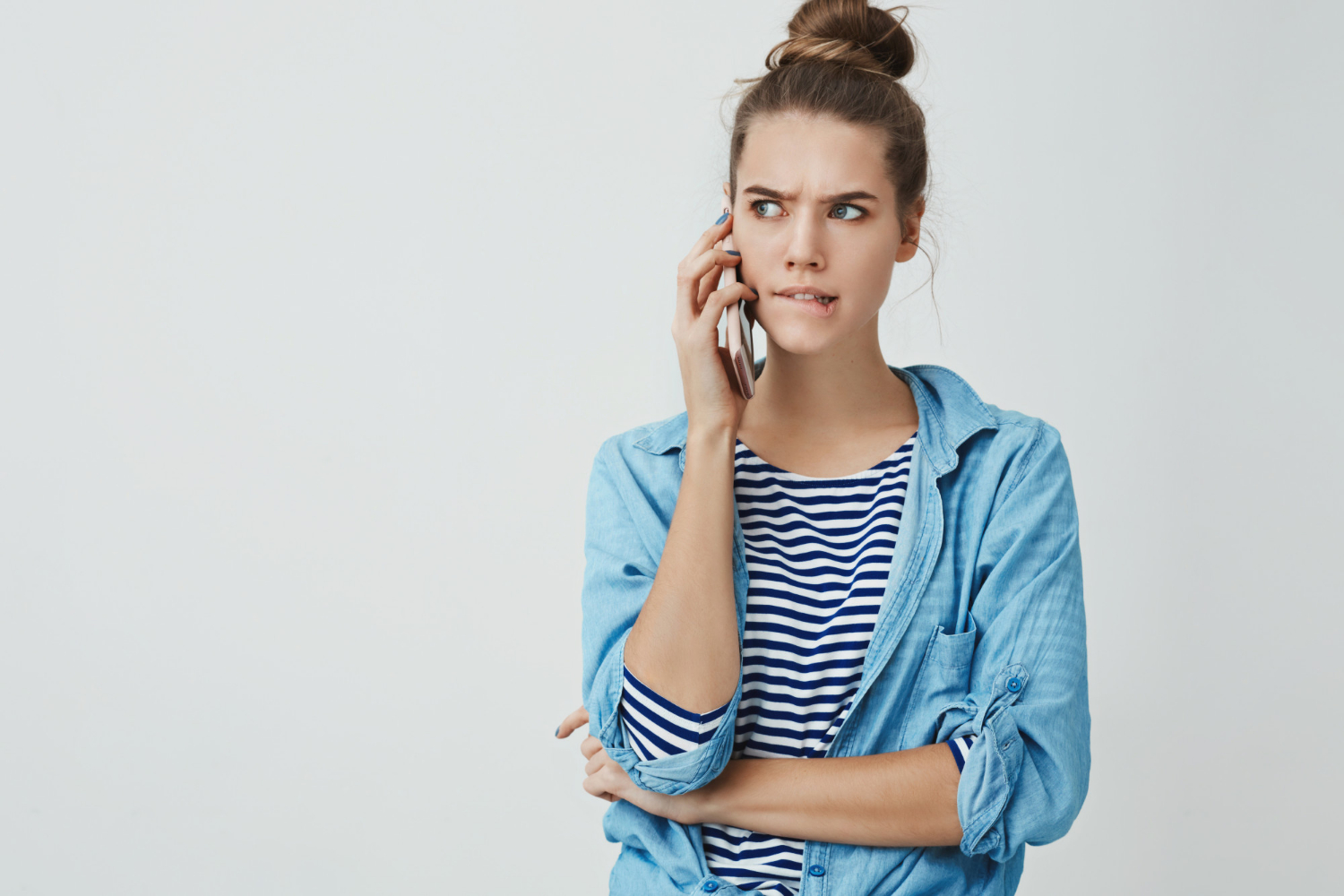 A frustrated woman engaged on a phonecall | Source: Freepik