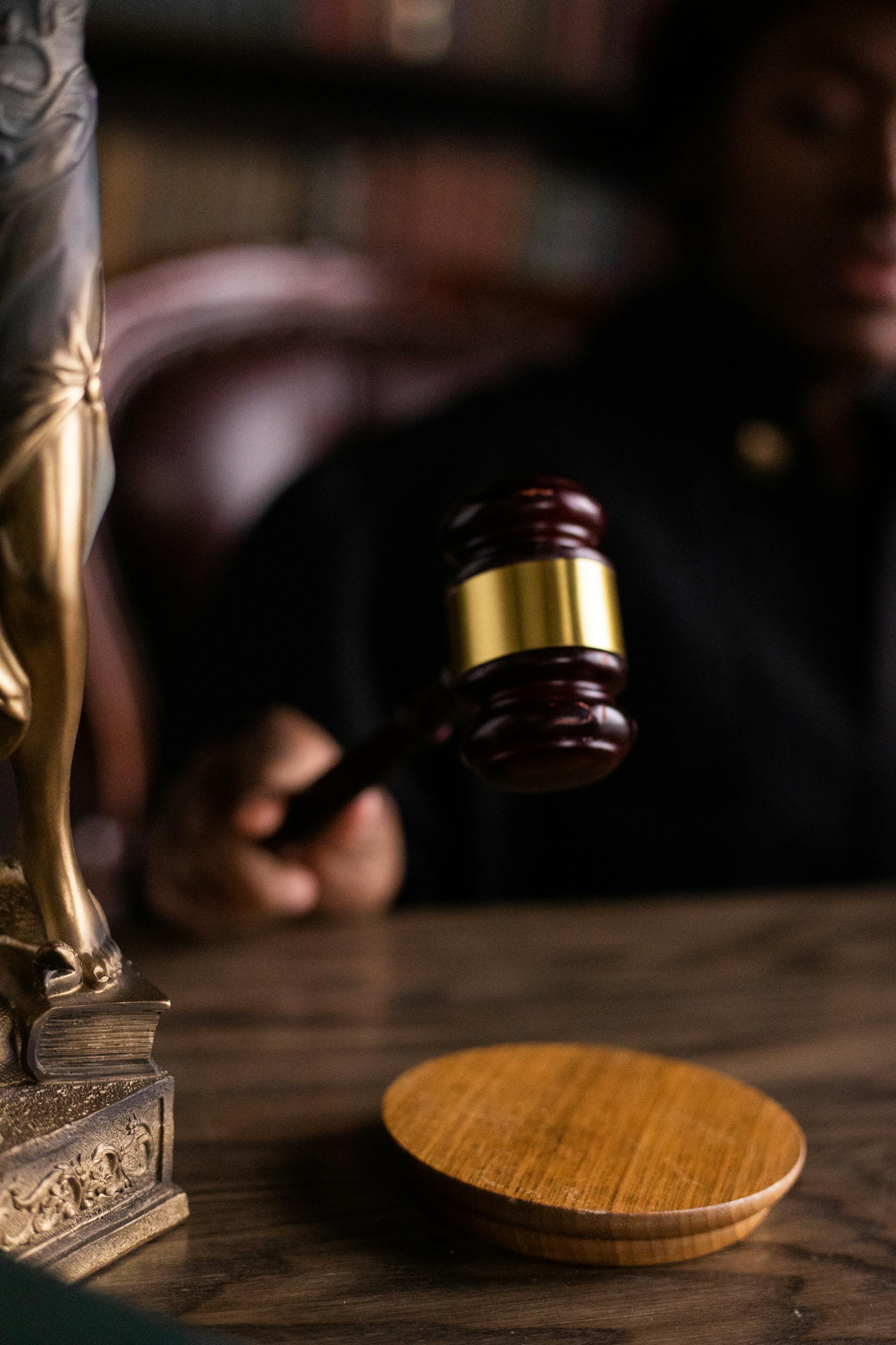 A judge holding a wooden gavel | Source: Pexels