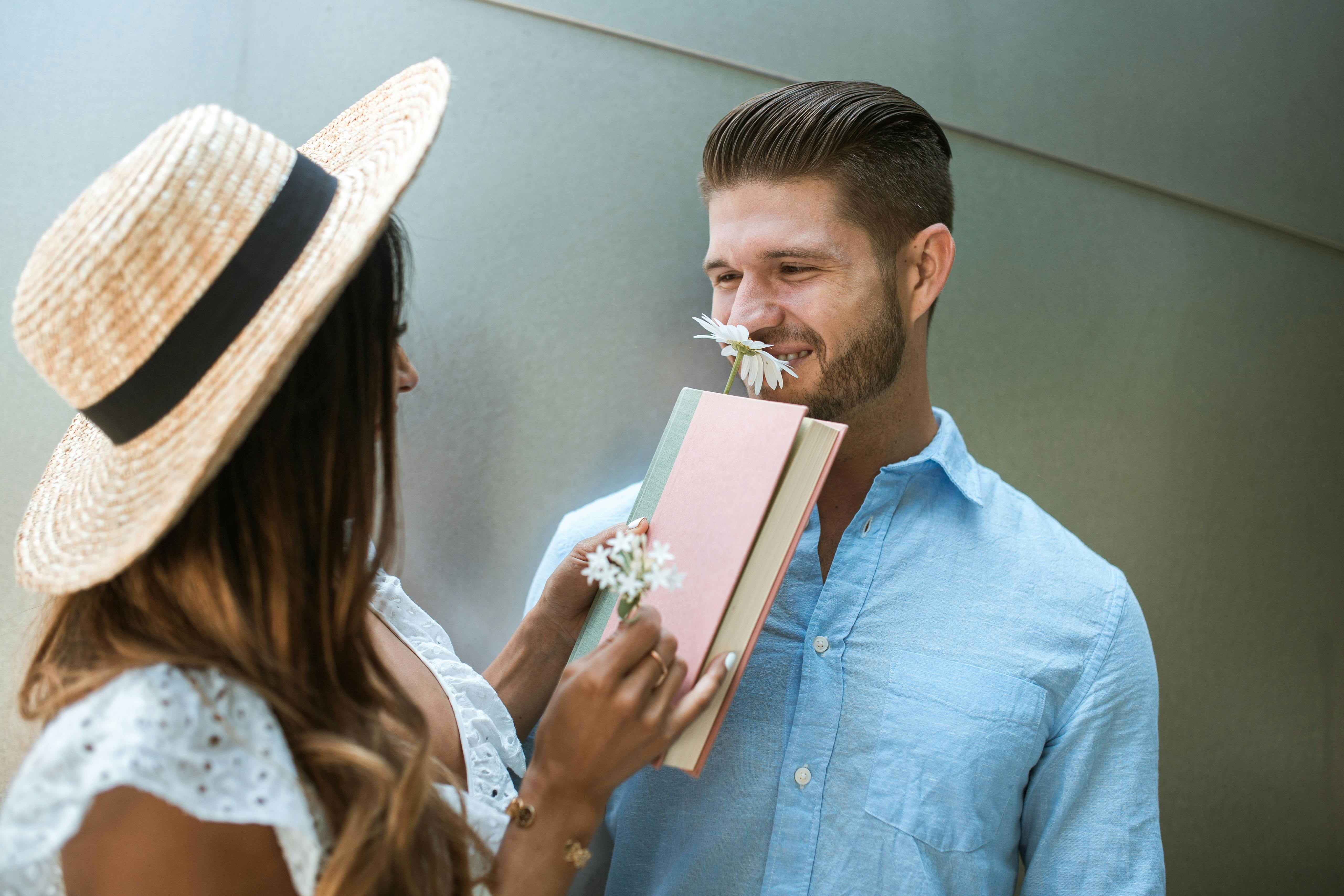 A man smiling at a woman | Source: Pexels
