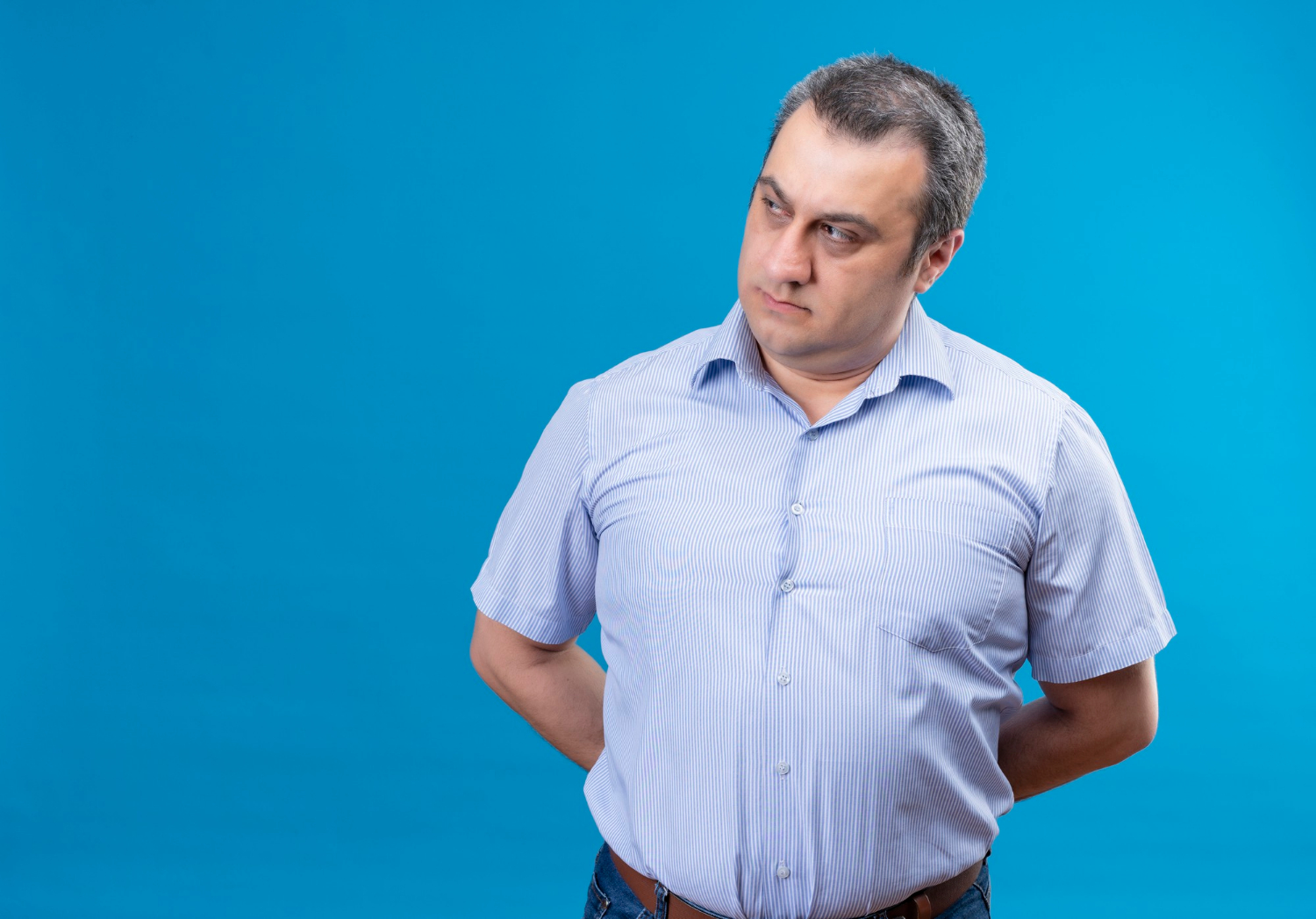 A man with a serious expression | Source: Freepik