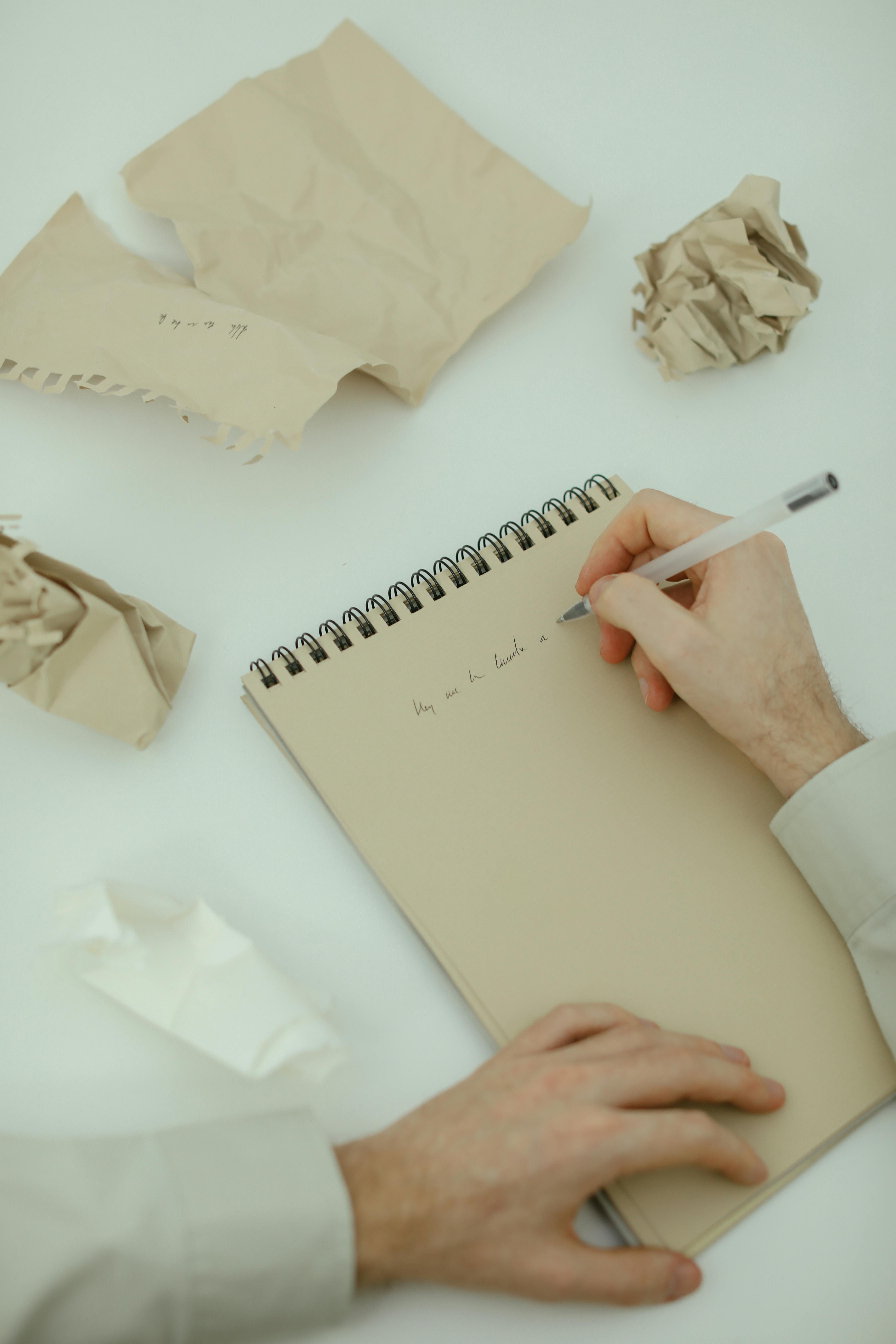 A person writing a letter | Source: Pexels