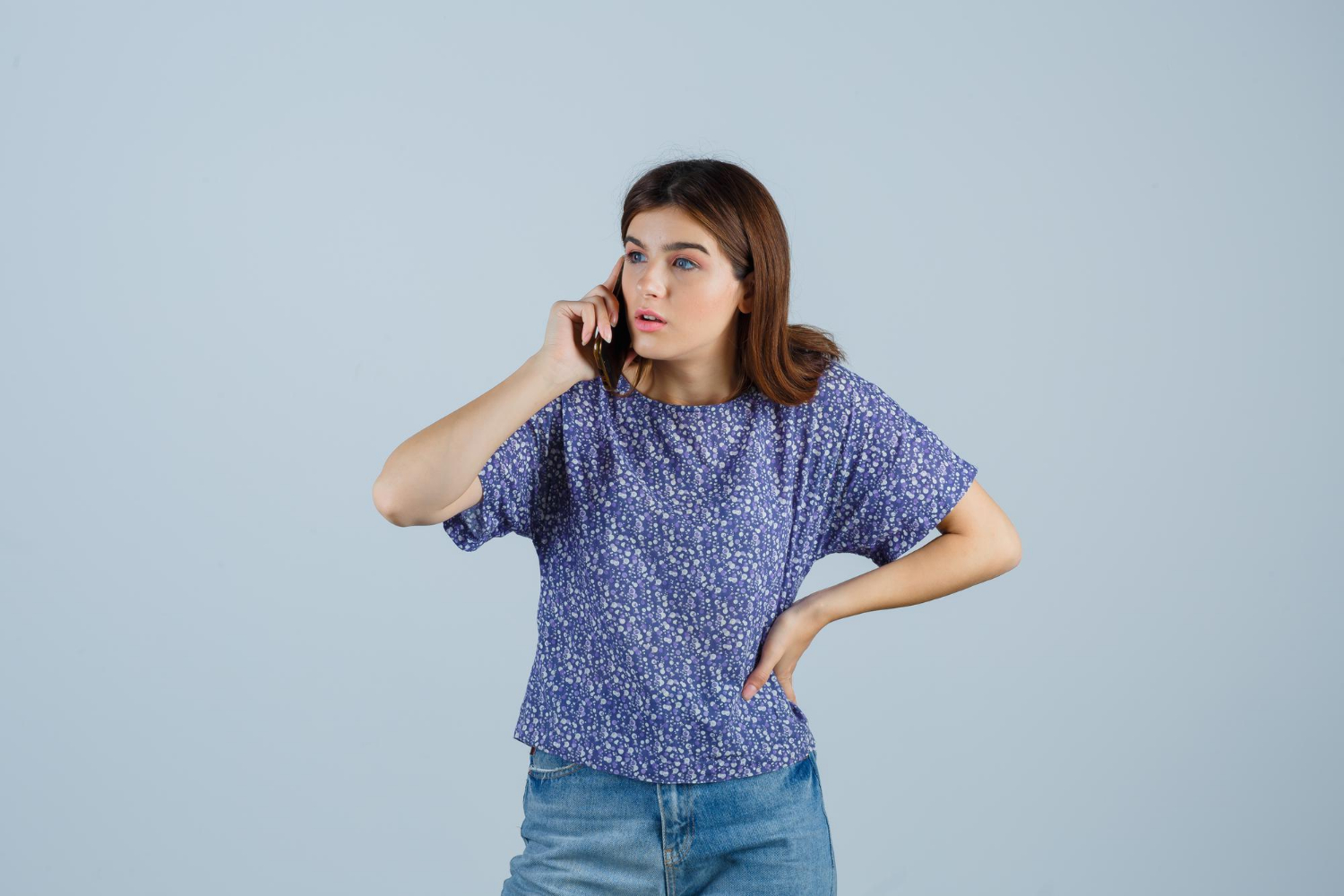 An annoyed woman talking on the phone | Source: Freepik