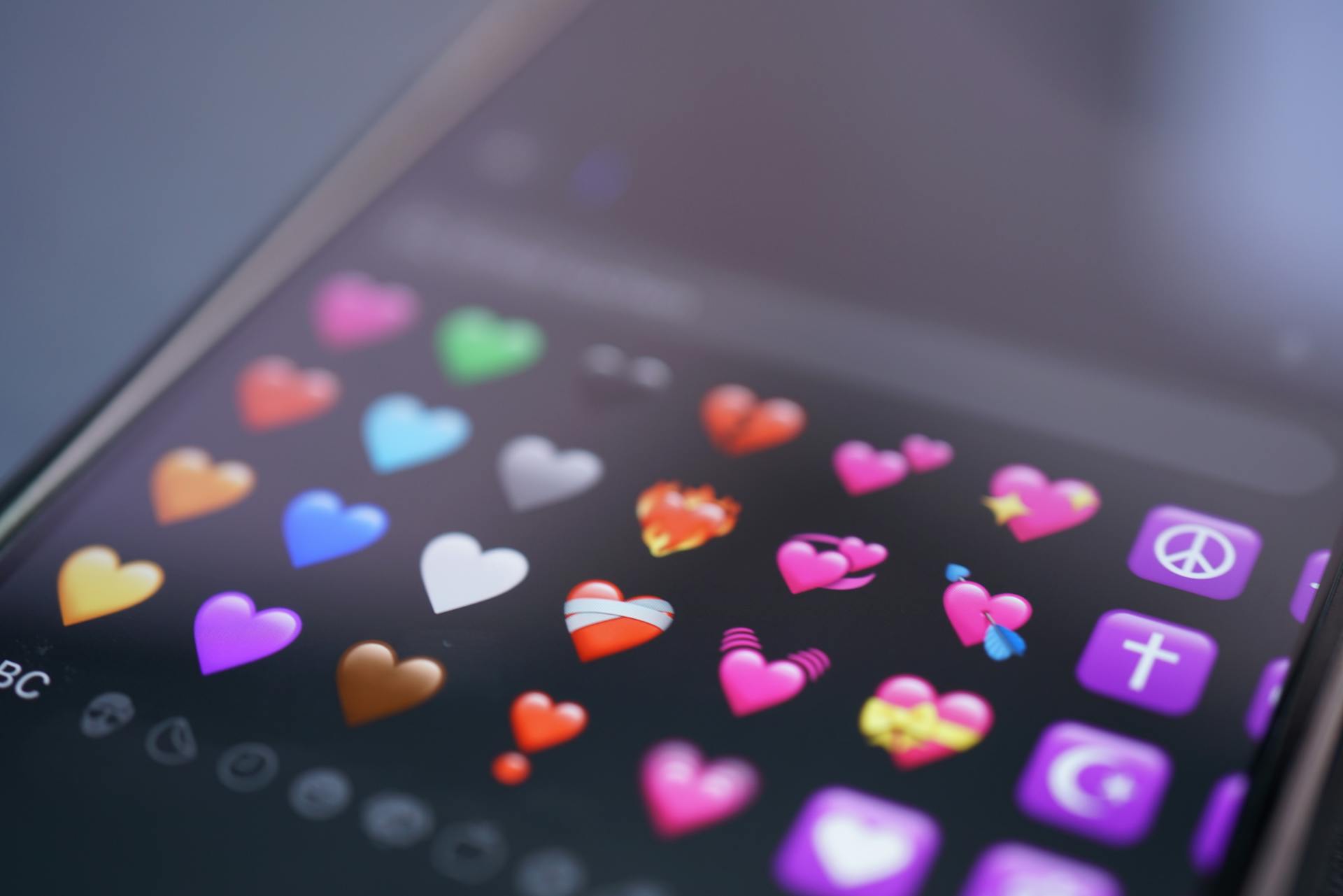 Colorful heart emojis on a smartphone screen | Source: Pexels