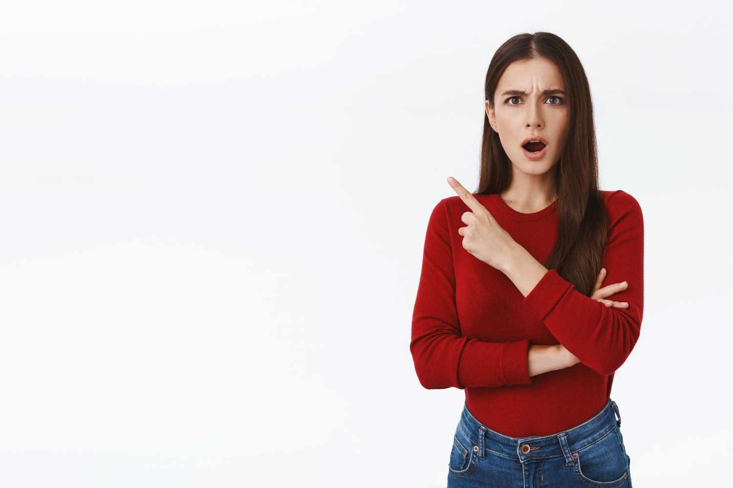 An angry woman gesturing at someone to leave | Source: Freepik