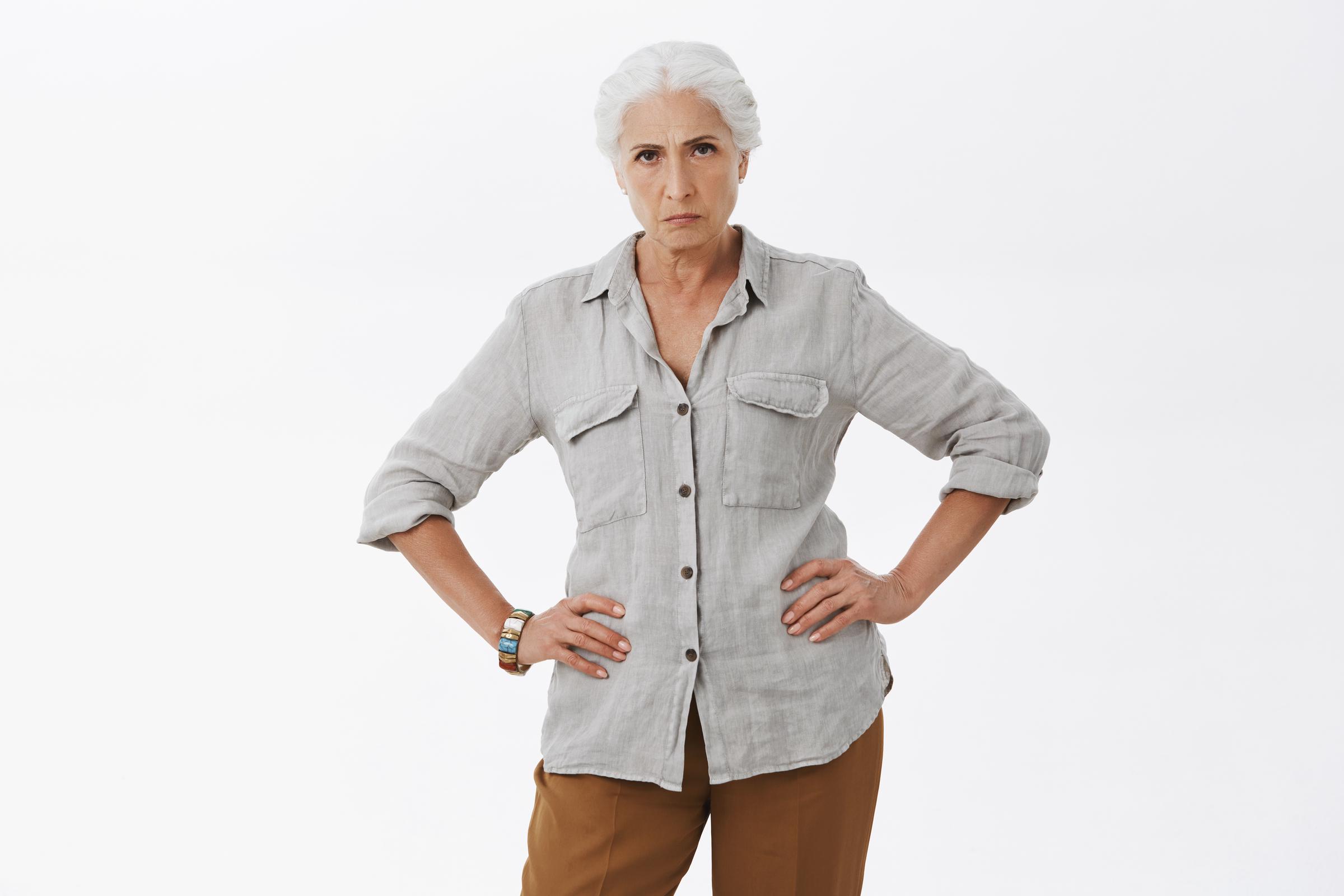 A serious woman standing | Source: Freepik