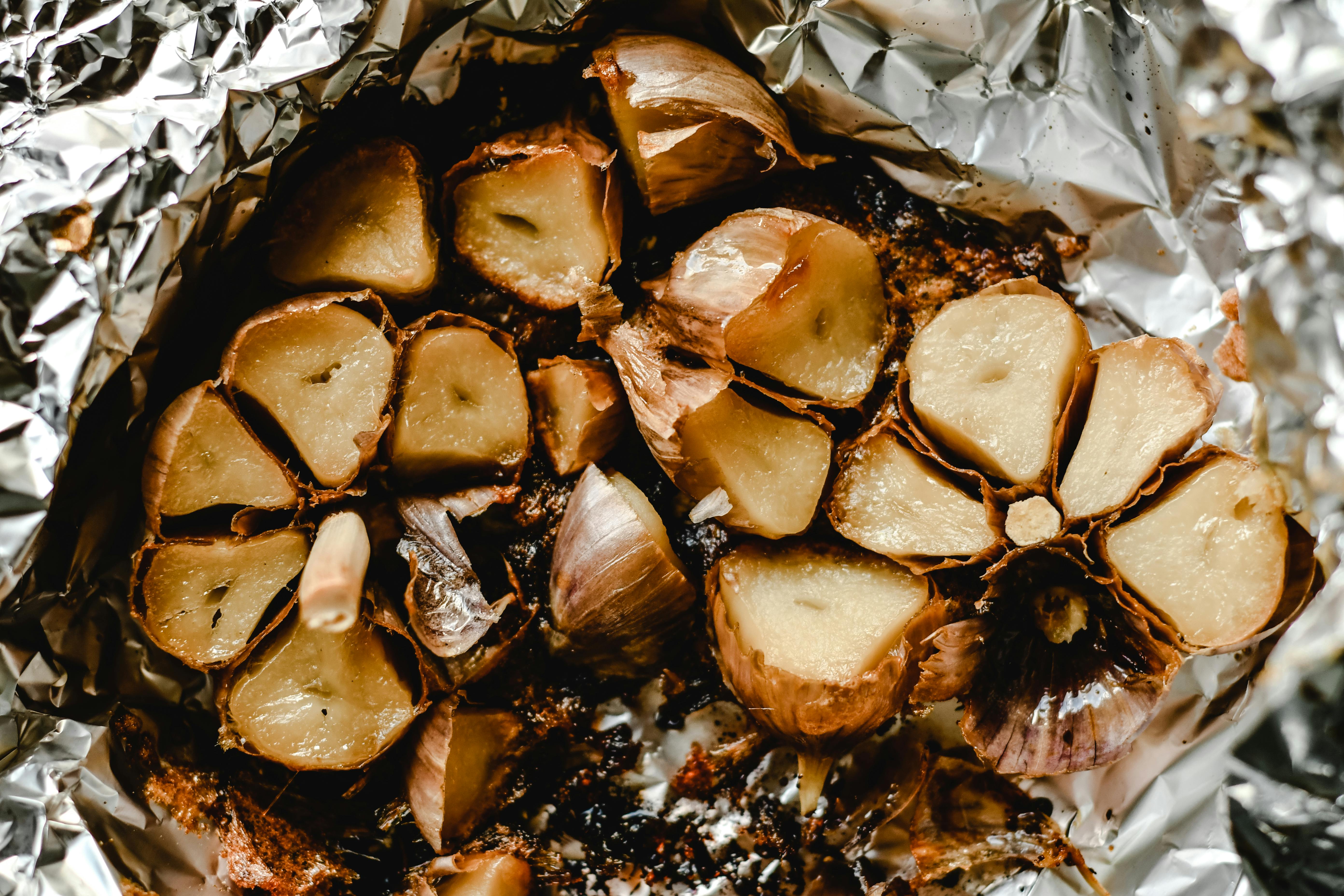 Roasted garlic wrapped in foil | Source: Pexels