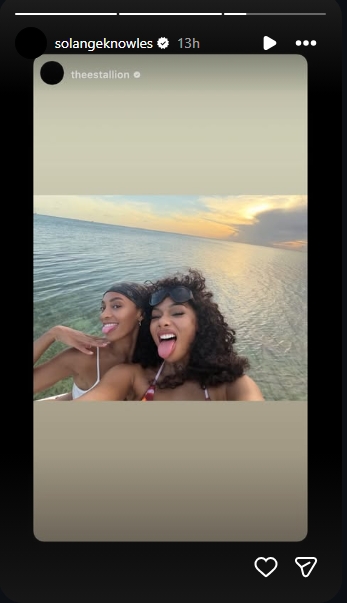 Megan Thee Stallion and Solange Knowles posed together near the water during their tropical getaway in a selfie shared to Instagram Stories on May 25, 2026. | Source: Instagram/solangeknowles
