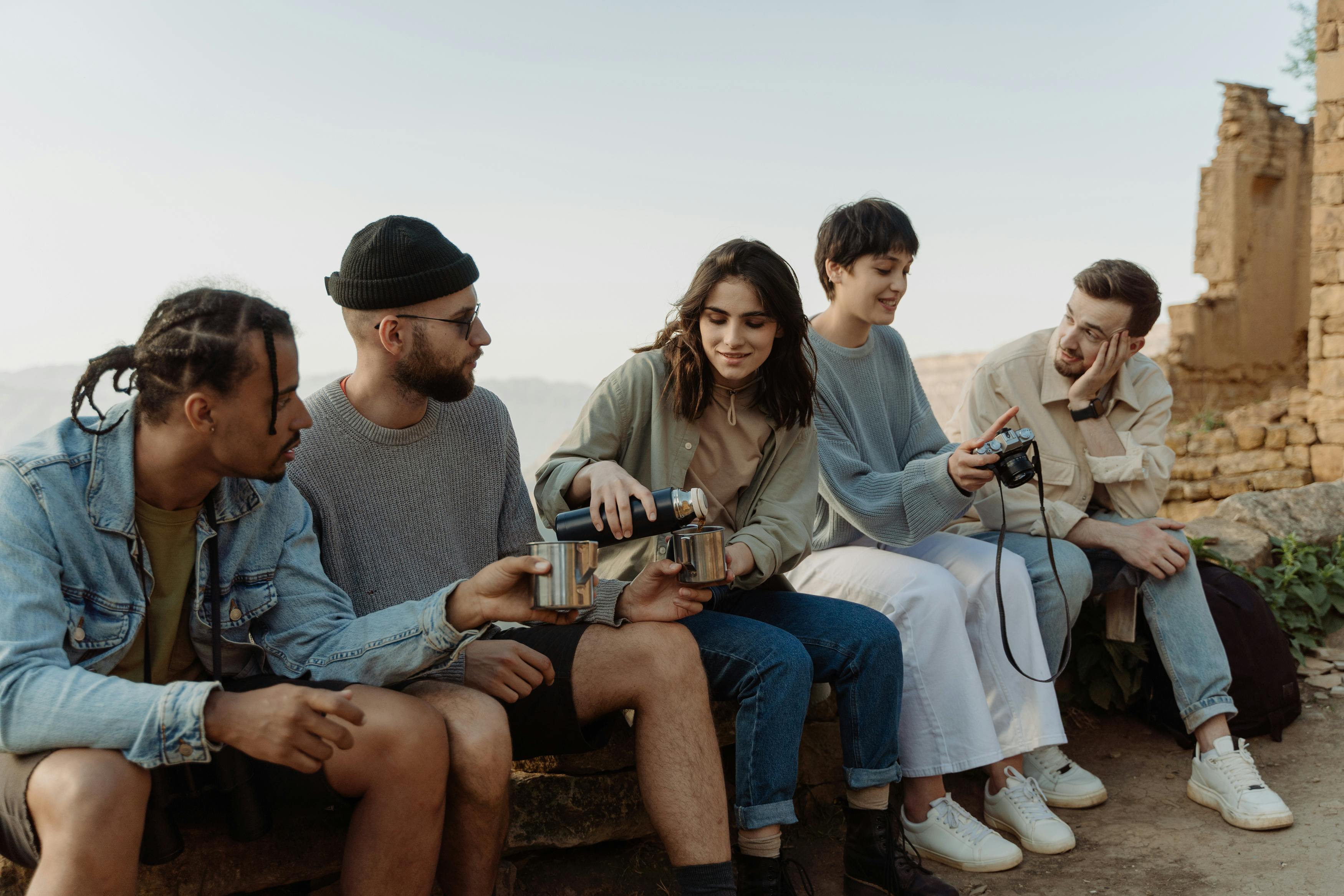 A group of people sitting on concrete bench | Source: Pexels