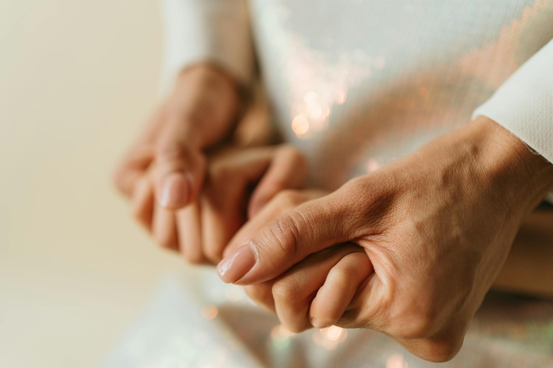 A woman holding her daughter's hands | Source: Pexels