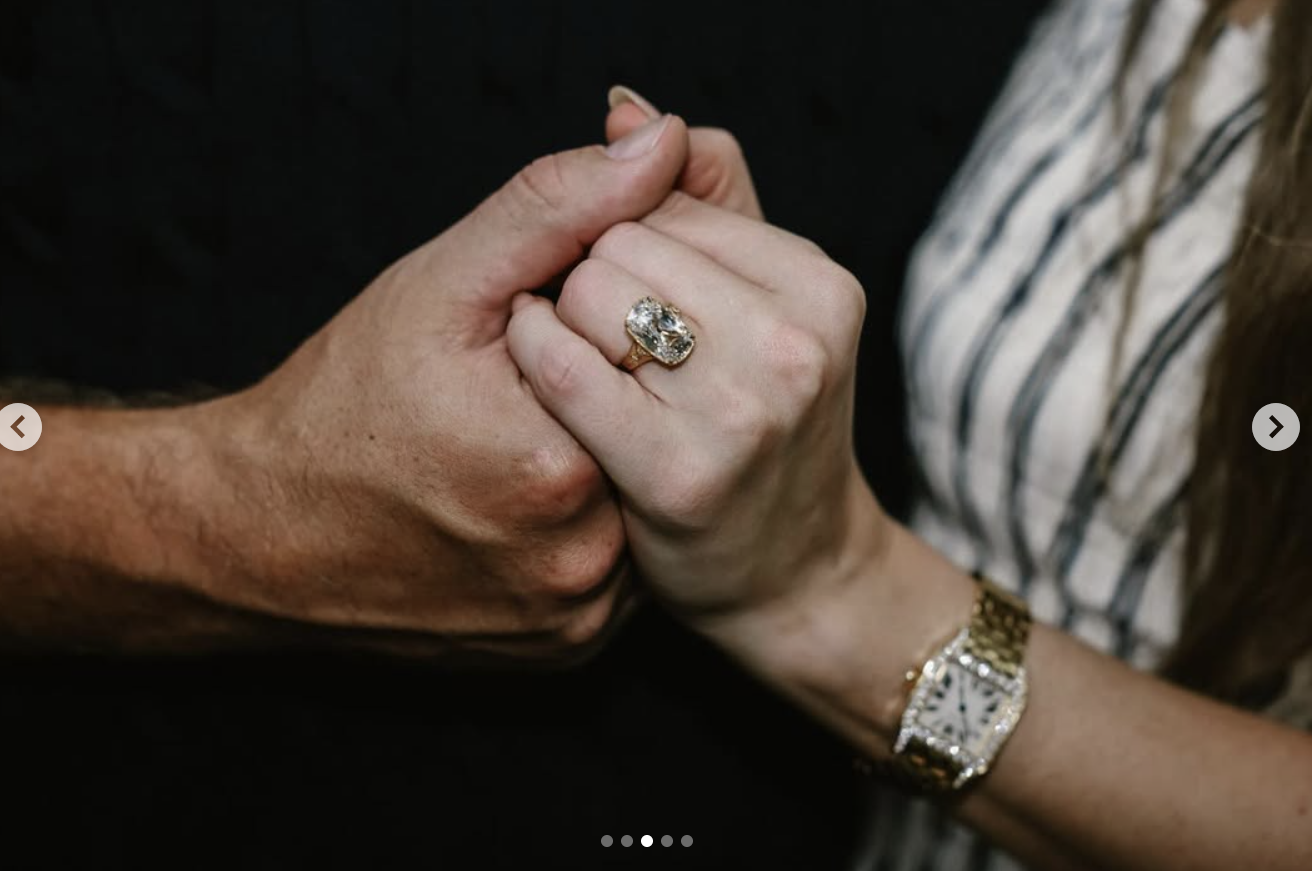 A closeup shot of Taylor Swift's engagement ring, designed by Travis Kelce himself, posted on August 26, 2025. | Source: Instagram/taylorswift