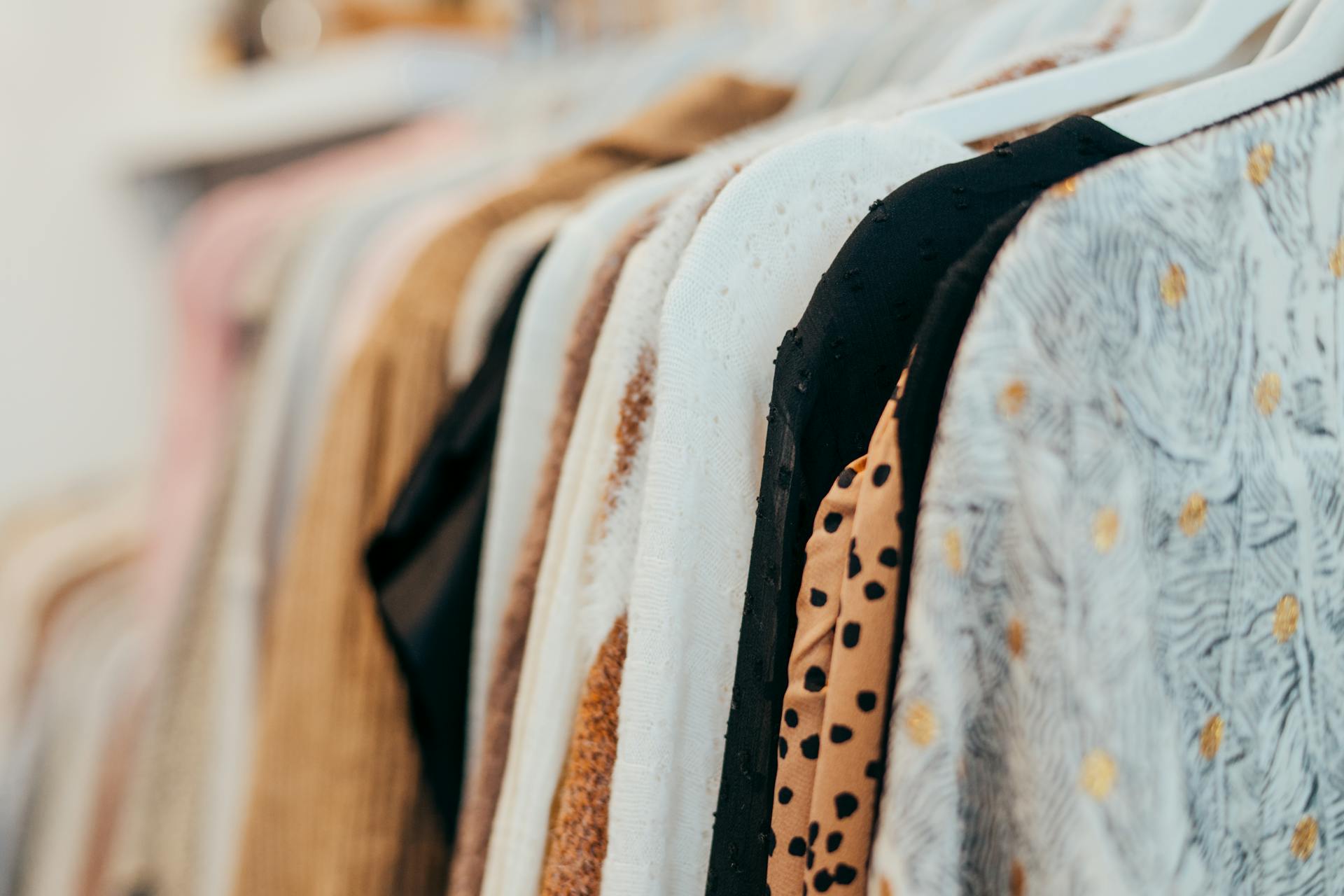 Clothes hanging in a closet | Source: Pexels